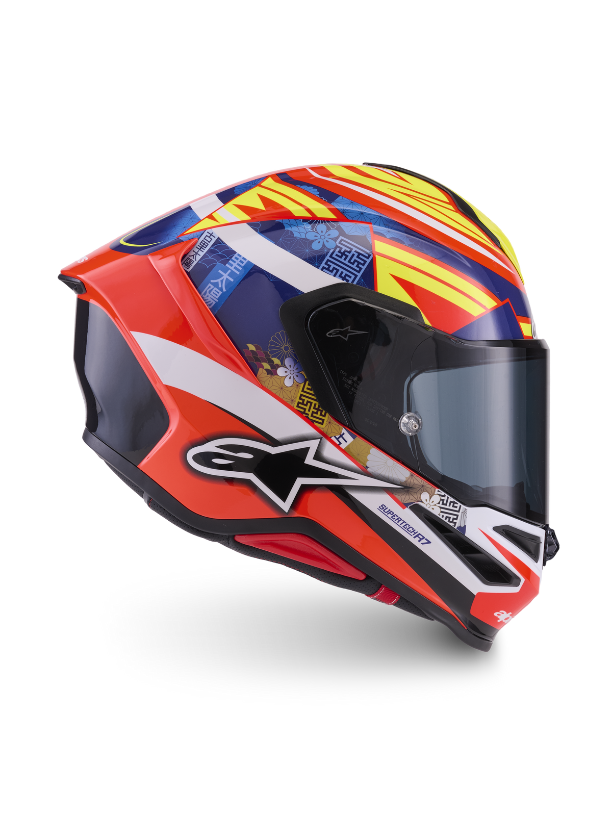 Alpinestars S-R7 Taiyo Furusato Helmet, Full Face Motorcycle Racing Helmet, Red and Blue with Yellow and White graphics, side profile view showing aerodynamic shell and graphic design, ECE 22.06 certified