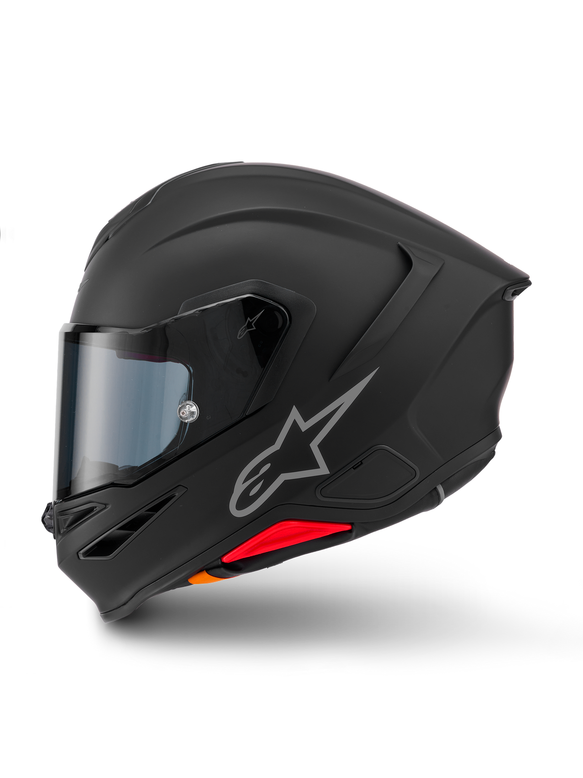 Alpinestars S-R7 Solid hjälm, integralhjälm för motorcykel, mattsvart, sidoprofil, med silverfärgad Astars-logotyp på sidan, aerodynamisk design med integrerad spoiler och hakventiler, samt röda och orangea detaljer vid basen.
