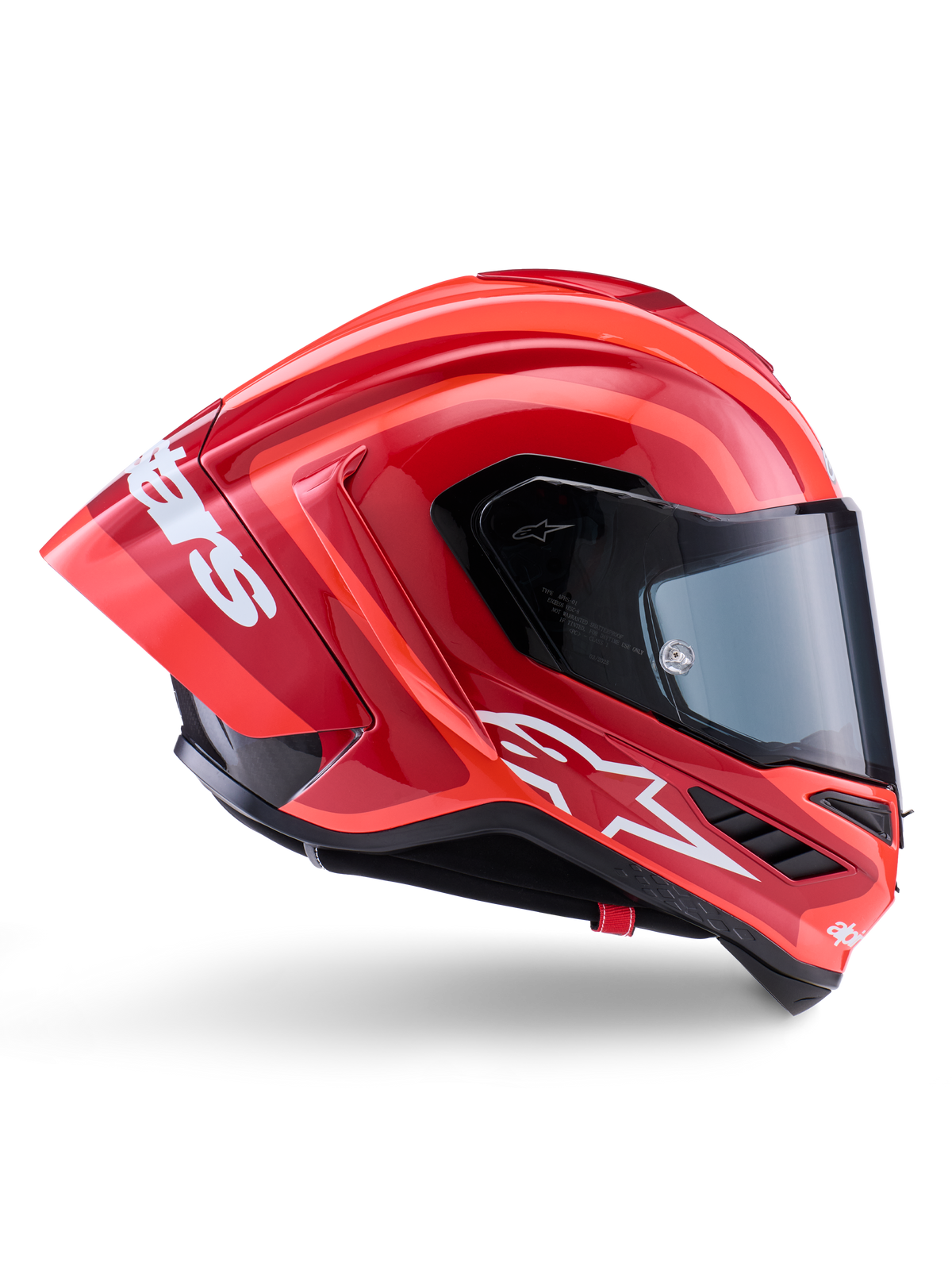Alpinestars Supertech R10 Arius hjälm, integral racinghjälm, blank röd och orange, sidoprofil med aerodynamisk bakspoiler, vit Astars-logotyp på hakan och klart visir, konstruerad för högpresterande bankörning