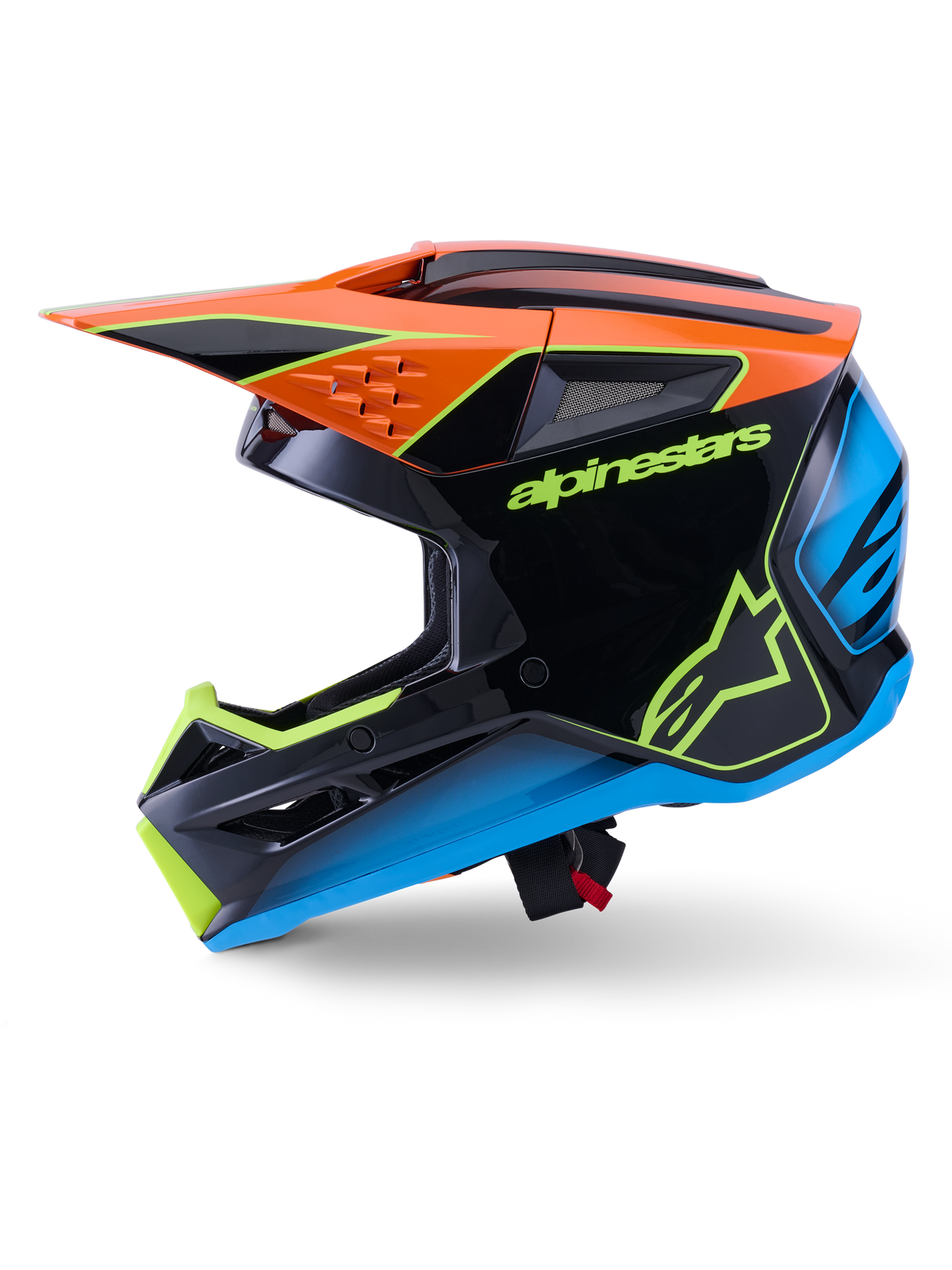 Alpinestars S-M3 Fray Hjälm ECE 22.06, motocrosshjälm, svart med orangea, blå och fluorescerande gula accenter, sidoprofilvy som visar det aerodynamiska skalet och integrerade ventilationsportar, med tydlig Alpinestars-logotyp, professionellt skydd för terrängkörning