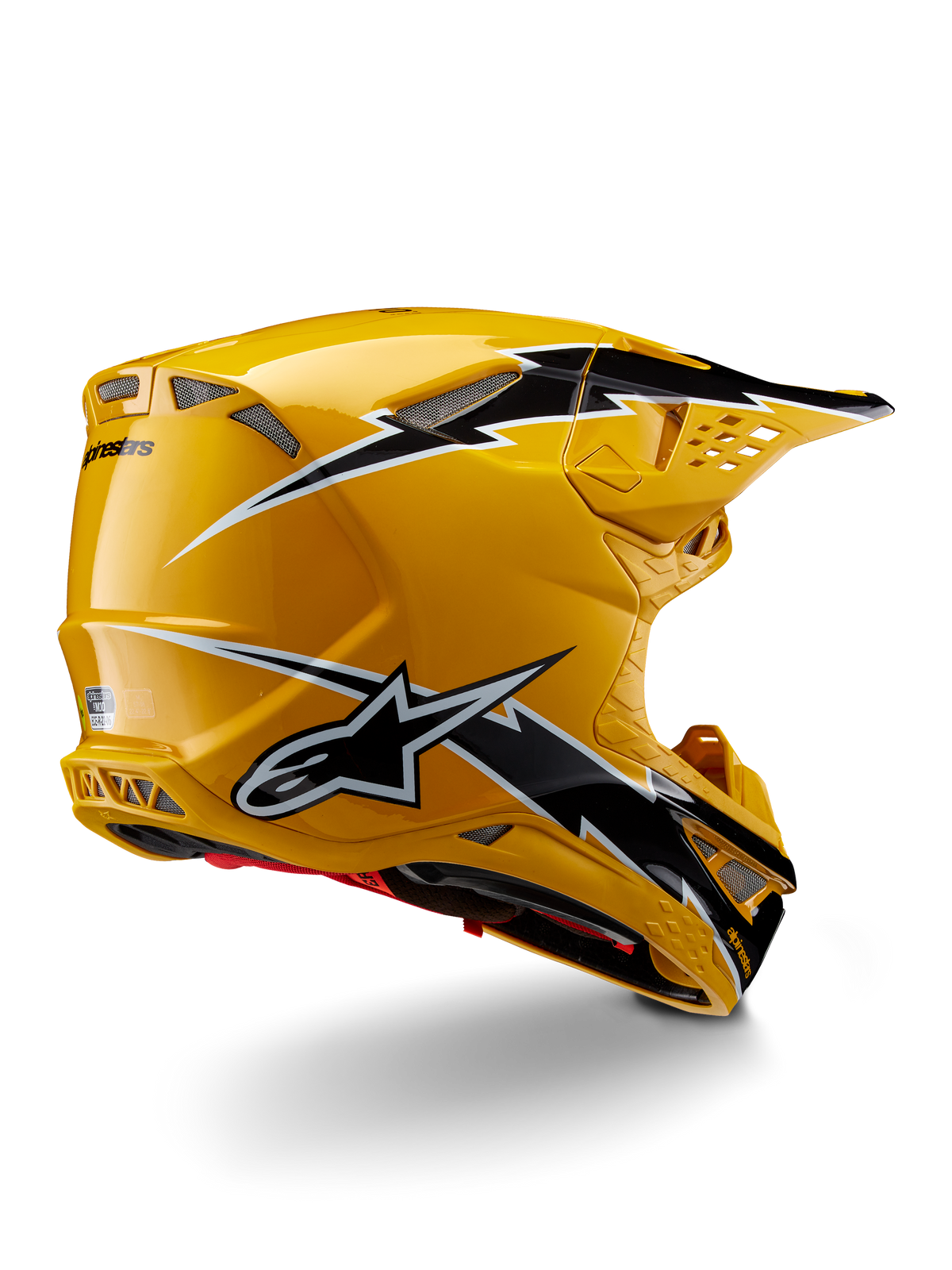 Alpinestars Supertech M10 Ampress-hjälm, motocrosshjälm, svart och gul glansig, med en högblank gul finish med svart och vit grafik i blixtstil, trekvartsvy bakifrån som visar det aerodynamiska skalet och integrerade ventilationsportar.