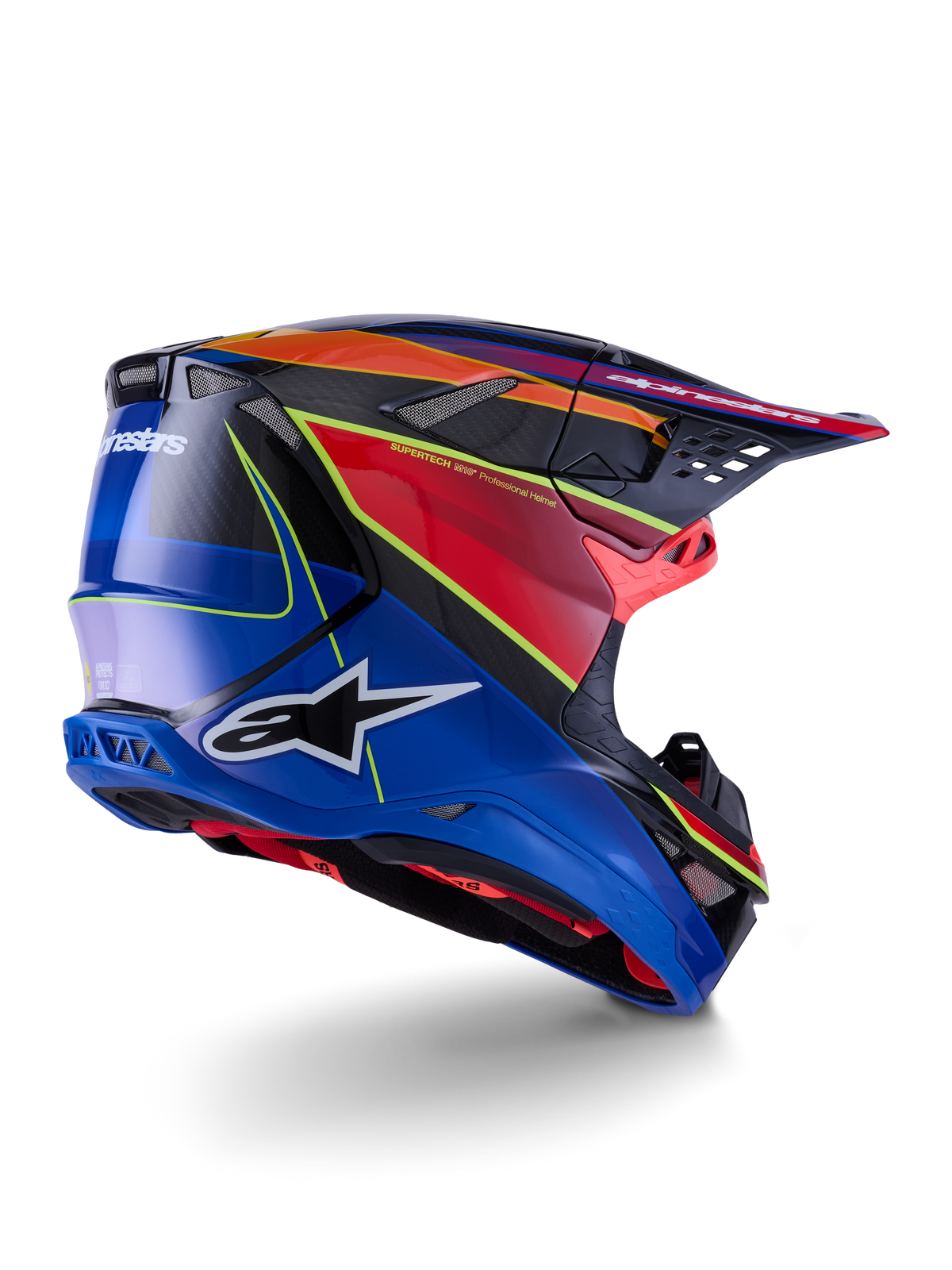 Alpinestars Supertech M10 Era-hjälm, motocrosshjälm, blå, röd och neongul blank finish, profilvy bakifrån med detaljer i kolfiberväv, tydlig Alpinestars-logotyp, integrerade ventilationsöppningar och högglansig finish för terrängkörning.