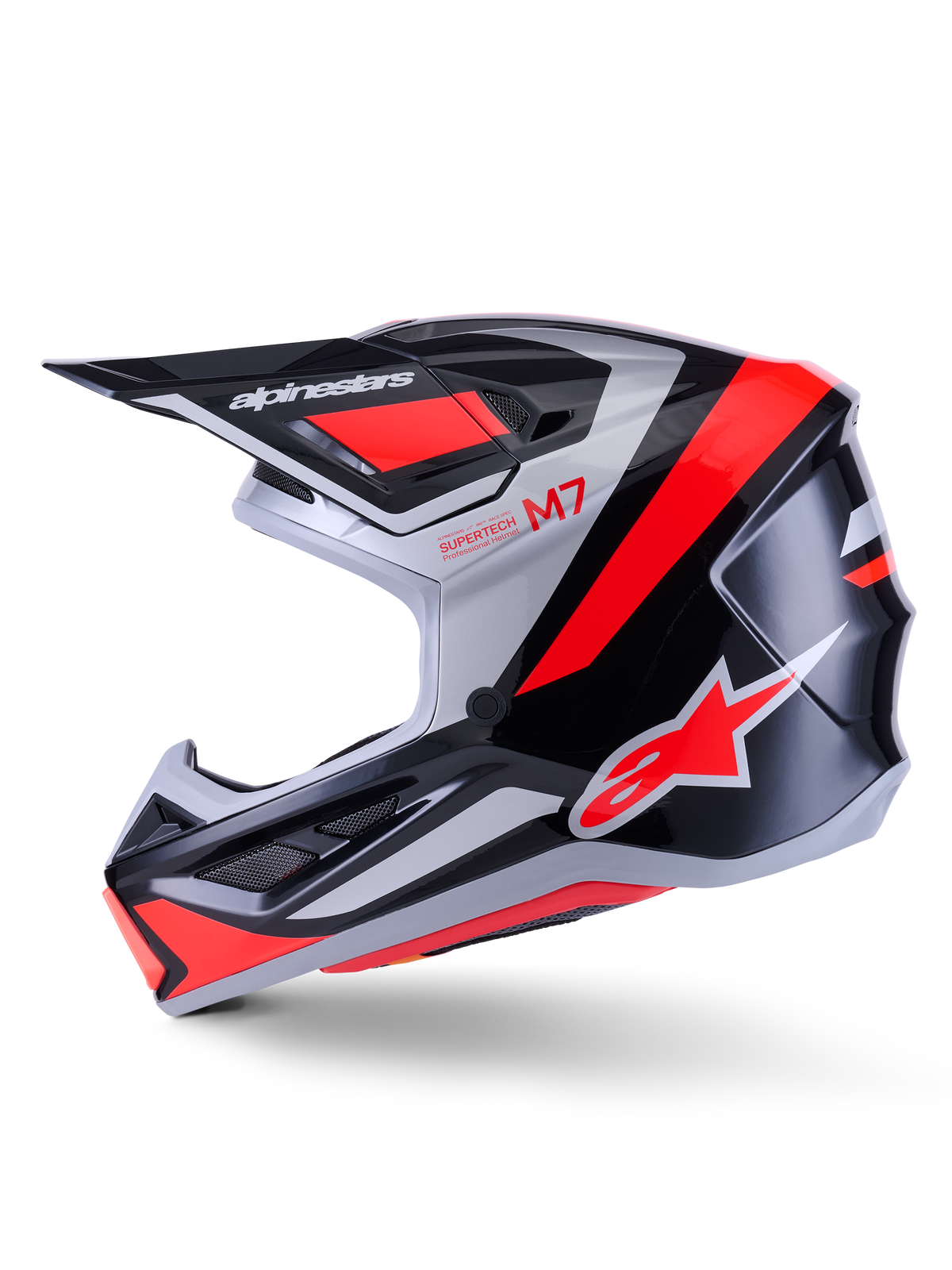 Alpinestars S-M7 Rise hjälm, motocrosshjälm, svart, silver och röd fluo, glansig finish, sidoprofil med aerodynamiskt kompositskal, ventilerat hakskydd och framträdande skärm med Alpinestars-logotyp.