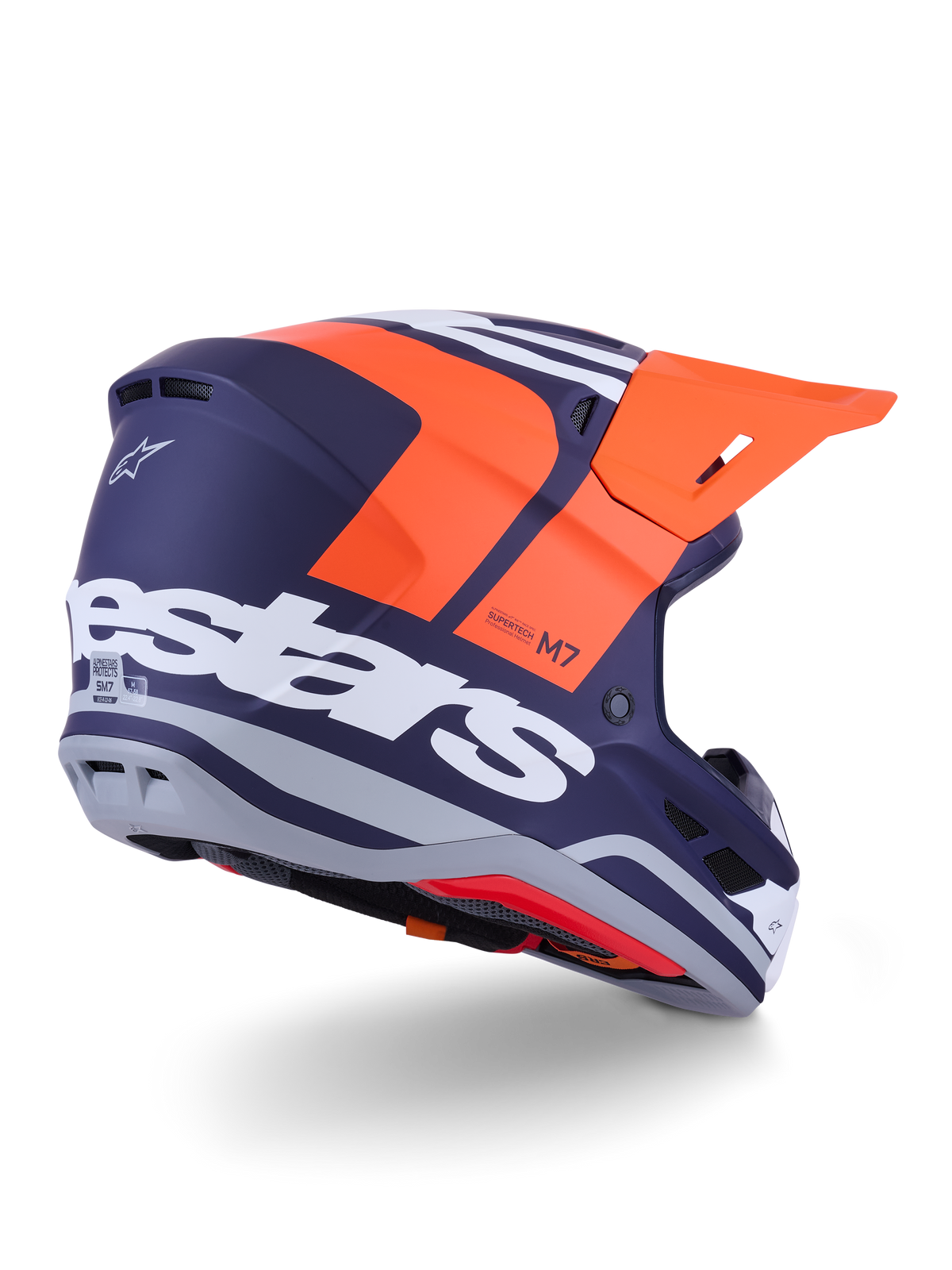 Alpinestars S-M7 Core-hjälm, motocrosshjälm, matt orange och blå, vy bakifrån från sidan med framträdande vit Alpinestars-logotyp över baksidan, klart orange visir, aerodynamiskt kompositskal med grå detaljer, professionellt skydd för terrängkörning