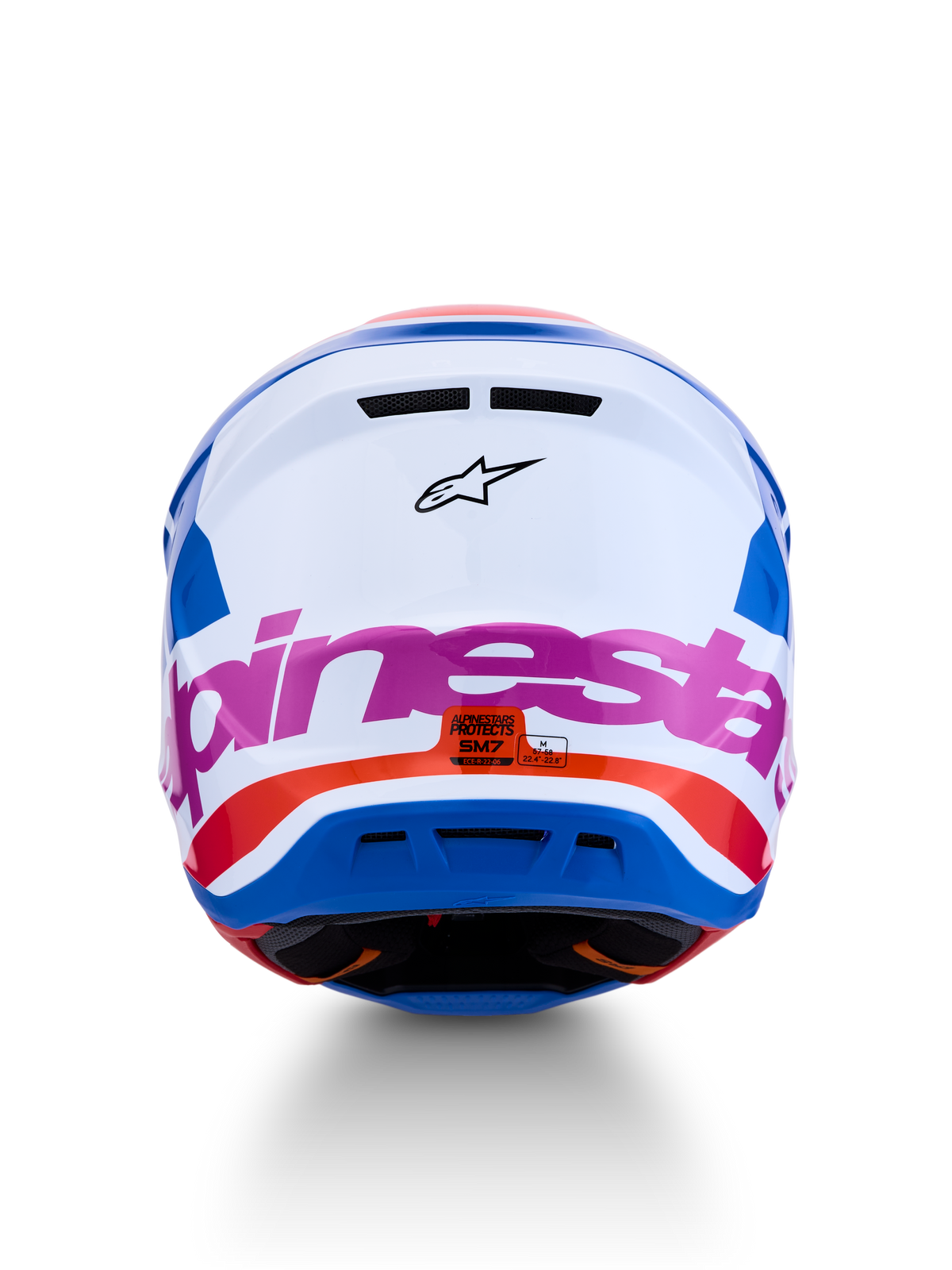 Alpinestars S-M7 Core hjälm, motocrosshjälm i vitt och blått med rosa och orangea detaljer, vy bakifrån, ECE 22.06-godkänd.