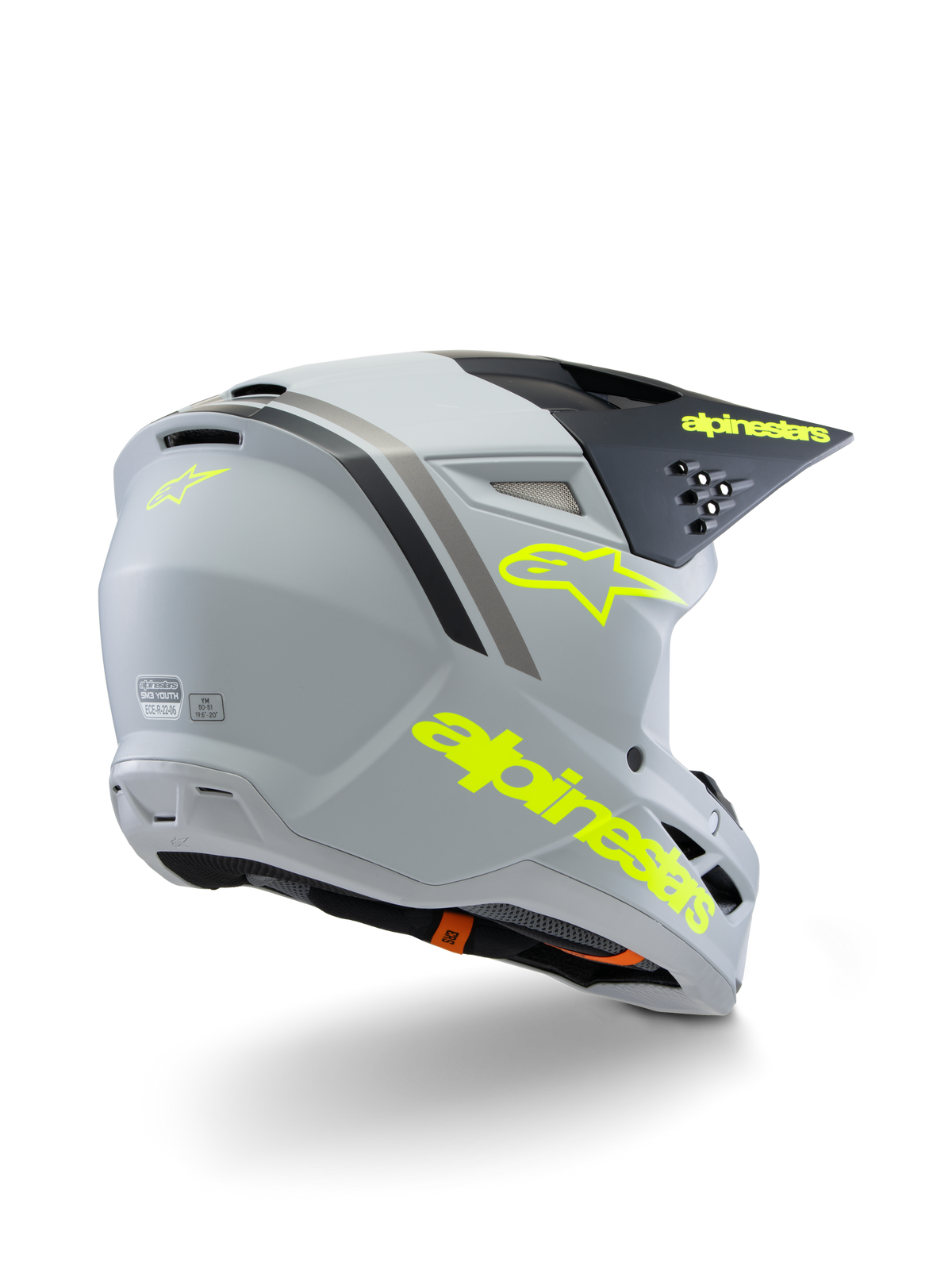 Alpinestars S-M3 Youth Radium Helmet ECE 22.06, motocrosshjälm, grå, svart och fluorescerande gul matt, vy trekvarts bakifrån som visar tydlig gul logotyp och stjärnsymbol, strömlinjeformat aerodynamiskt skal med ventilation för terrängkörning