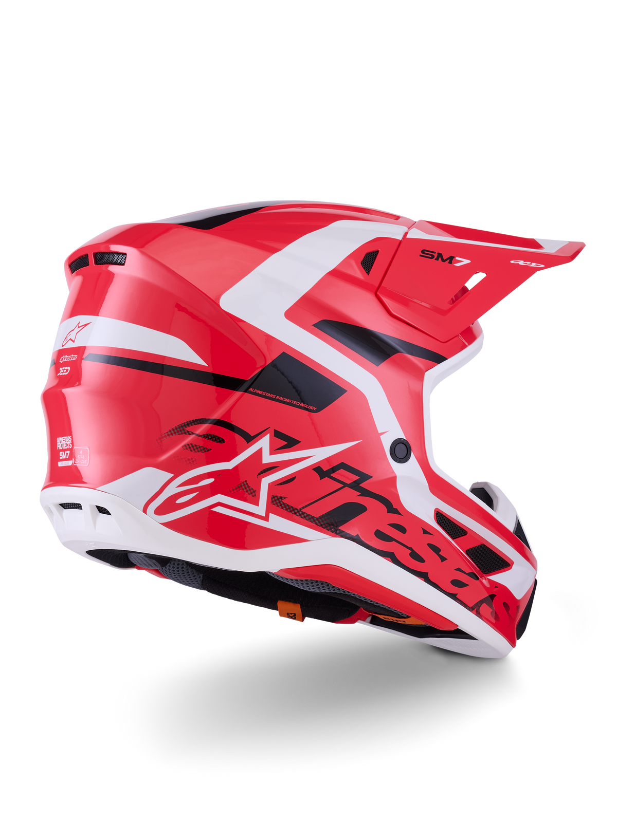 Alpinestars S-M7 Deed-hjälm, motocrosshjälm, röd, svart och vit glansig finish, med ett aerodynamiskt skal, ventilationsöppningar och framträdande Alpinestars-logotyp, trekvartsvy bakifrån