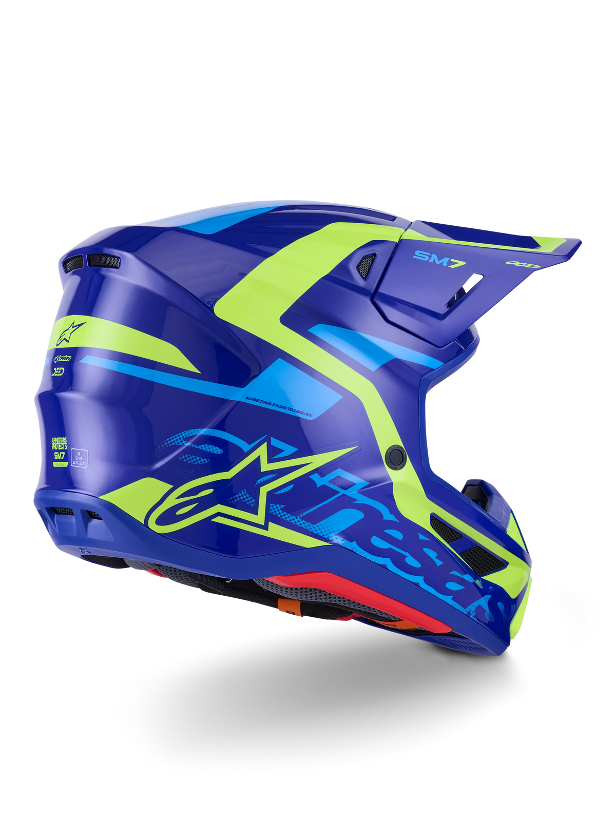 Alpinestars S-M7 Deed-hjälm ECE 22.06, motocrosshjälm, blå och gul fluo med glansig finish, vy snett bakifrån med en strömlinjeformad aerodynamisk skalprofil, tydlig Alpinestars-logotyp med neongula detaljer, högpresterande ventilationsportar och en glansig yta för terrängkörning.