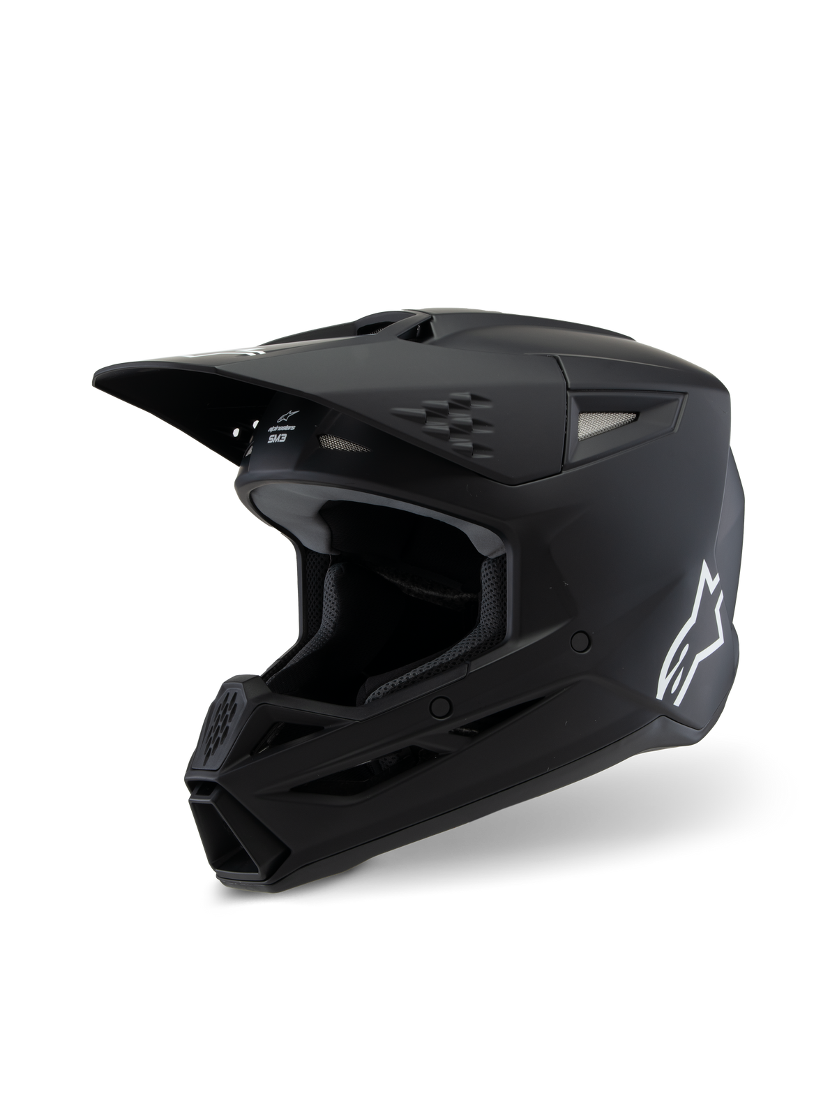 Alpinestars S-M3 Youth Solid hjälm ECE 22.06, motocrosshjälm, matt svart, profilvy med vit Alpinestars-logotyp, aerodynamiskt skal med ventilationsöppningar och integrerat visir, professionellt huvudskydd för terrängkörning för ungdomar