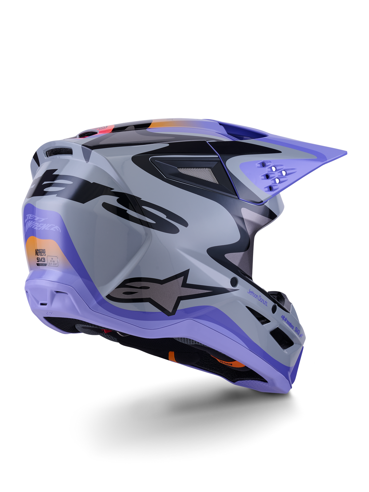 Alpinestars S-M3 Jettson-hjälm ECE 22.06, motocrosshjälm, grå, lila och glansig svart, trekvartsvy bakifrån som visar aerodynamiskt termoinjicerat skal med ventilationsportar och djärv grafisk design