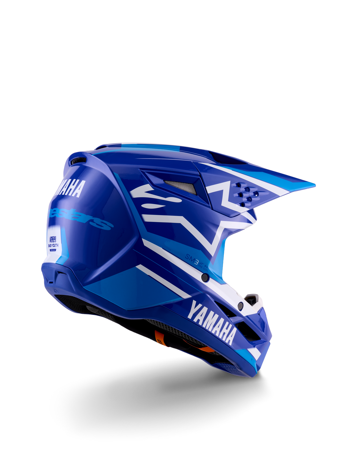 Alpinestars Yamaha S-M3 Youth Motocross Helmet, Blue and White Glossy, featuring bold Yamaha branding on the side and back, aerodynamic shell design with rear ventilation, youth-specific off-road head protection in a three-quarter rear view.