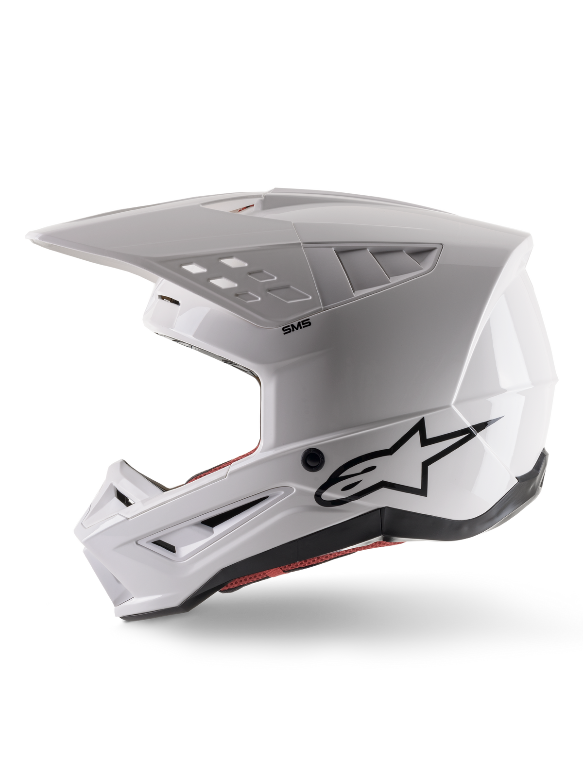 Alpinestars S-M5 Solid Helmet ECE 22.06, motocrosshjälm, vit glansig, vy i sidoprofil med vinklad skaldesign, svart Alpinestars-logotyp på sidan, flera ventilationsöppningar och integrerat visir för terrängkörning.