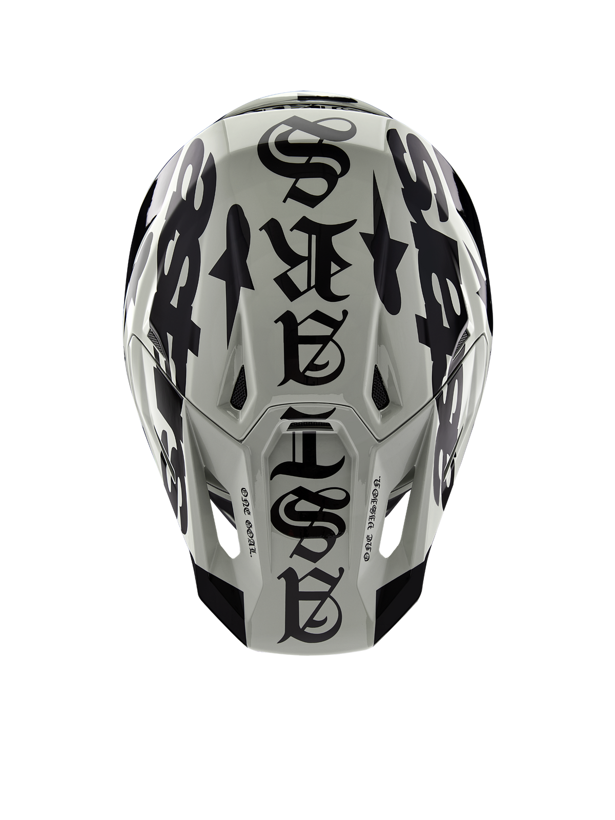 Alpinestars Limited Edition S-M7 Wolf Dust hjälm, sedd ovanifrån, glansig finish i Dune och svart, med framträdande typografi i gotisk stil över hjässan och One Goal One Vision-detaljer, professionellt huvudskydd för motocrossracing