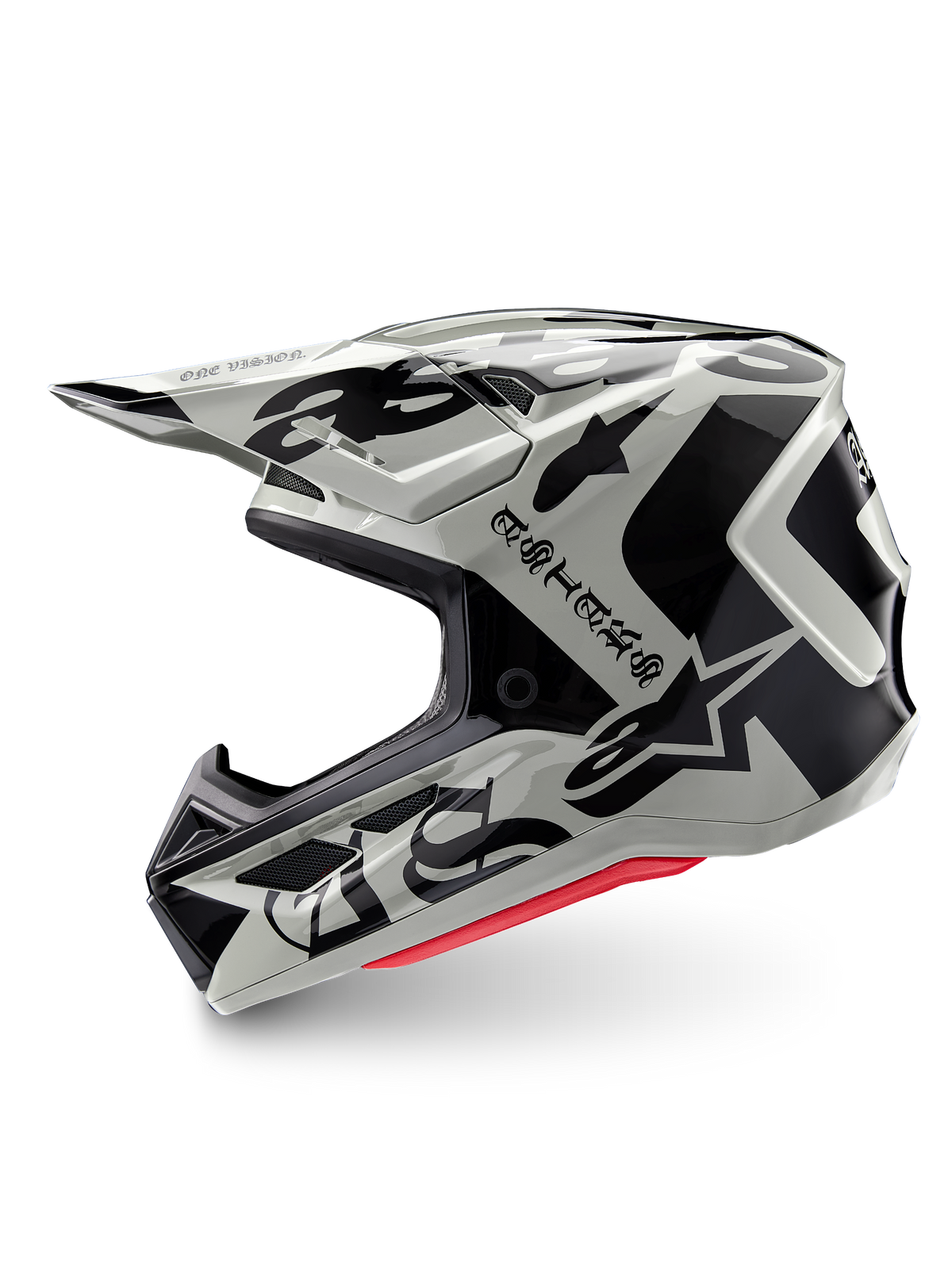 Alpinestars Limited Edition S-M7 Wolf Dust-hjälm, motocrosshjälm, Dune Black Glossy, off-white skal med svart gotisk ASTARS-logotyp och grafiska mönster, synlig röd invändig stoppning, aerodynamisk profil för terrängkörning