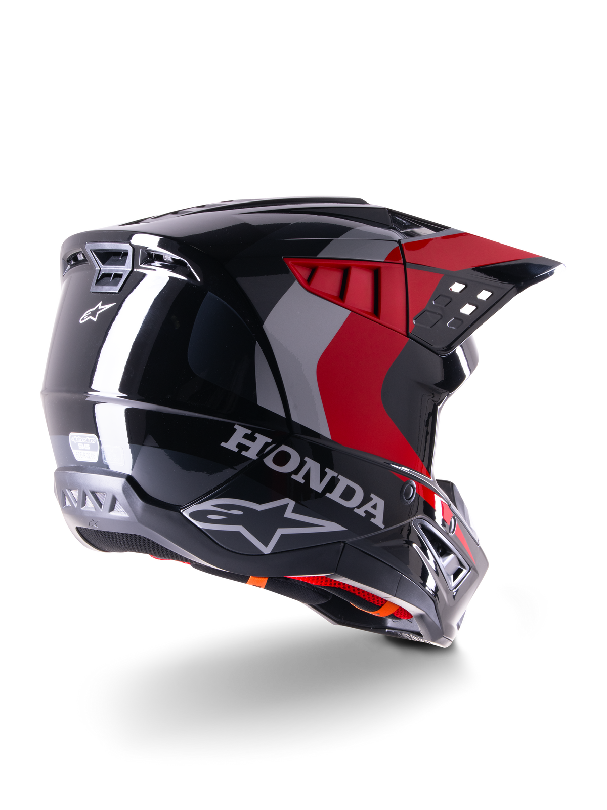 Alpinestars Honda S-M5 ECE-hjälm, motocrosshjälm, blank svart och röd, trekvartsvy bakifrån med Honda-logotyp och Alpinestars-logotyper, blank finish med röda och grå grafiska detaljer, designad för skydd vid terrängkörning