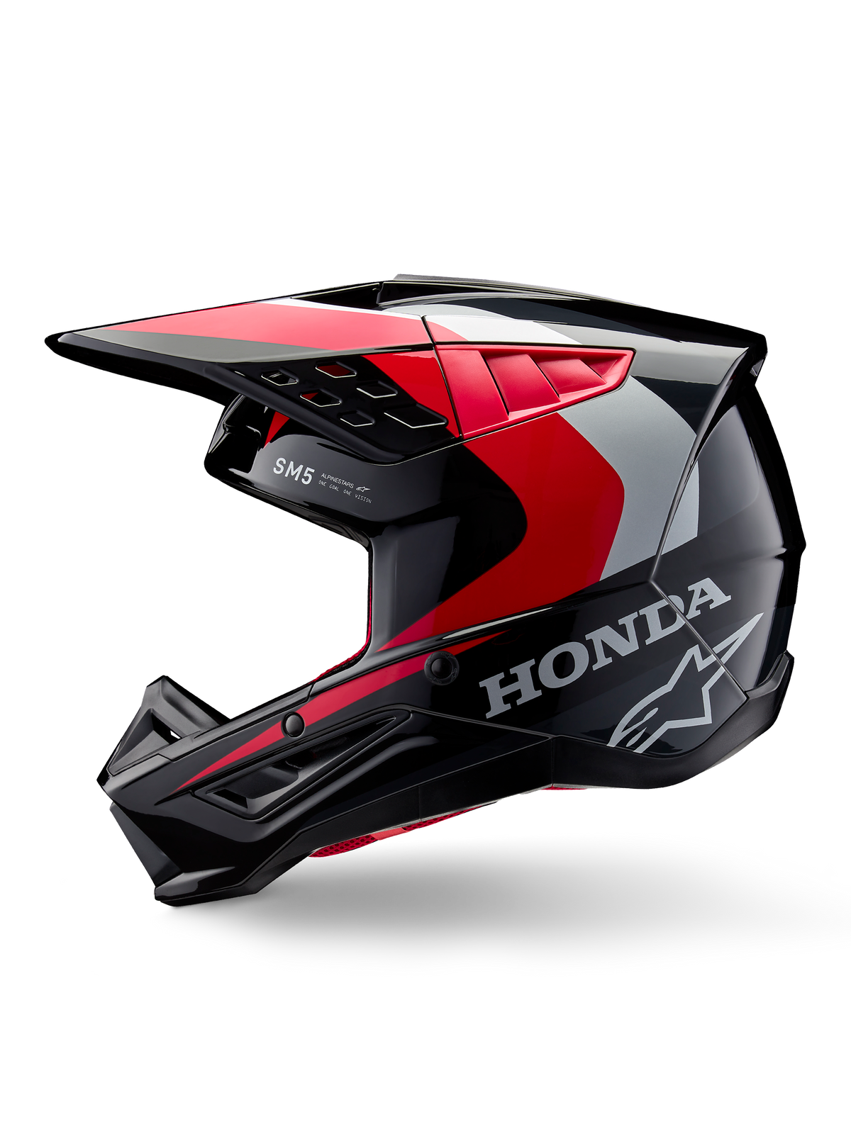 Alpinestars Honda S-M5-hjälm, motocrosshjälm, svart, röd och silver med glansig finish, profilvy med Honda-branding och Alpinestars stjärnlogotyp, strömlinjeformad design med integrerad skärm och ventilationsportar för terrängkörning