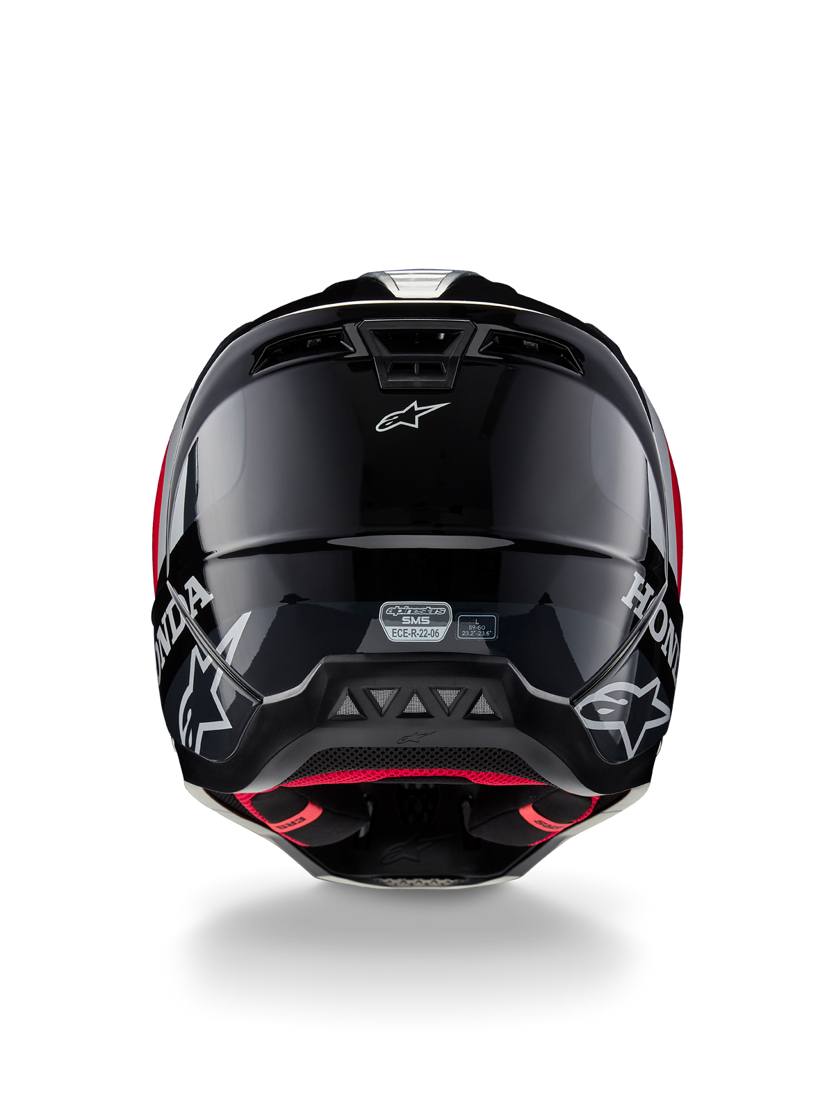 Alpinestars Honda S-M5 ECE-hjälm, motocrosshjälm, blank svart och röd, baksida som visar ett blankt svart skal med vita Honda- och Alpinestars-logotyper, rött innerfoder och ECE-säkerhetscertifieringsetikett