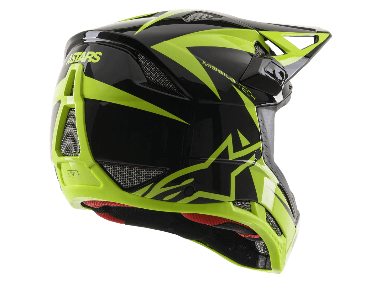 Alpinestars Missile Tech-Air fullfacehjälm, blank svart och neongul, vy snett bakifrån med stora ventilationsöppningar i mesh, ASTARS-logotyp och rött innerfoder, designad för downhill-MTB-prestanda