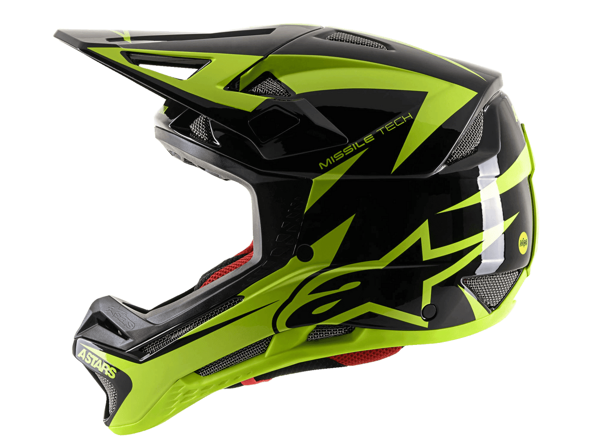 Alpinestars Missile Tech-Air integralhjälm, MTB-fullfacehjälm, svart och neongul blank finish, profilvy som framhäver en stor gul stjärnlogotyp, ventilationsöppningar i nät och aerodynamiskt visir för downhill-cykling