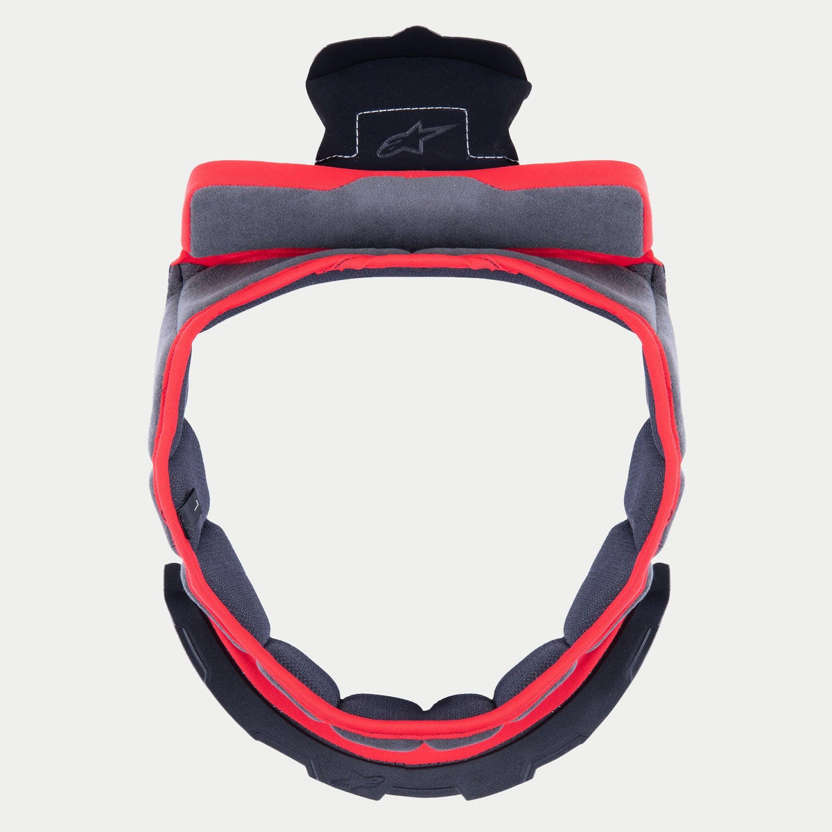 Alpinestars Supertech R10 kronkudde, ersättningsfoder för hjälm, grått mjukt tyg med röd kant och svarta fästflikar, cirkulär design för S-R10-hjälmar, med broderad stjärnlogotyp på den övre fliken.