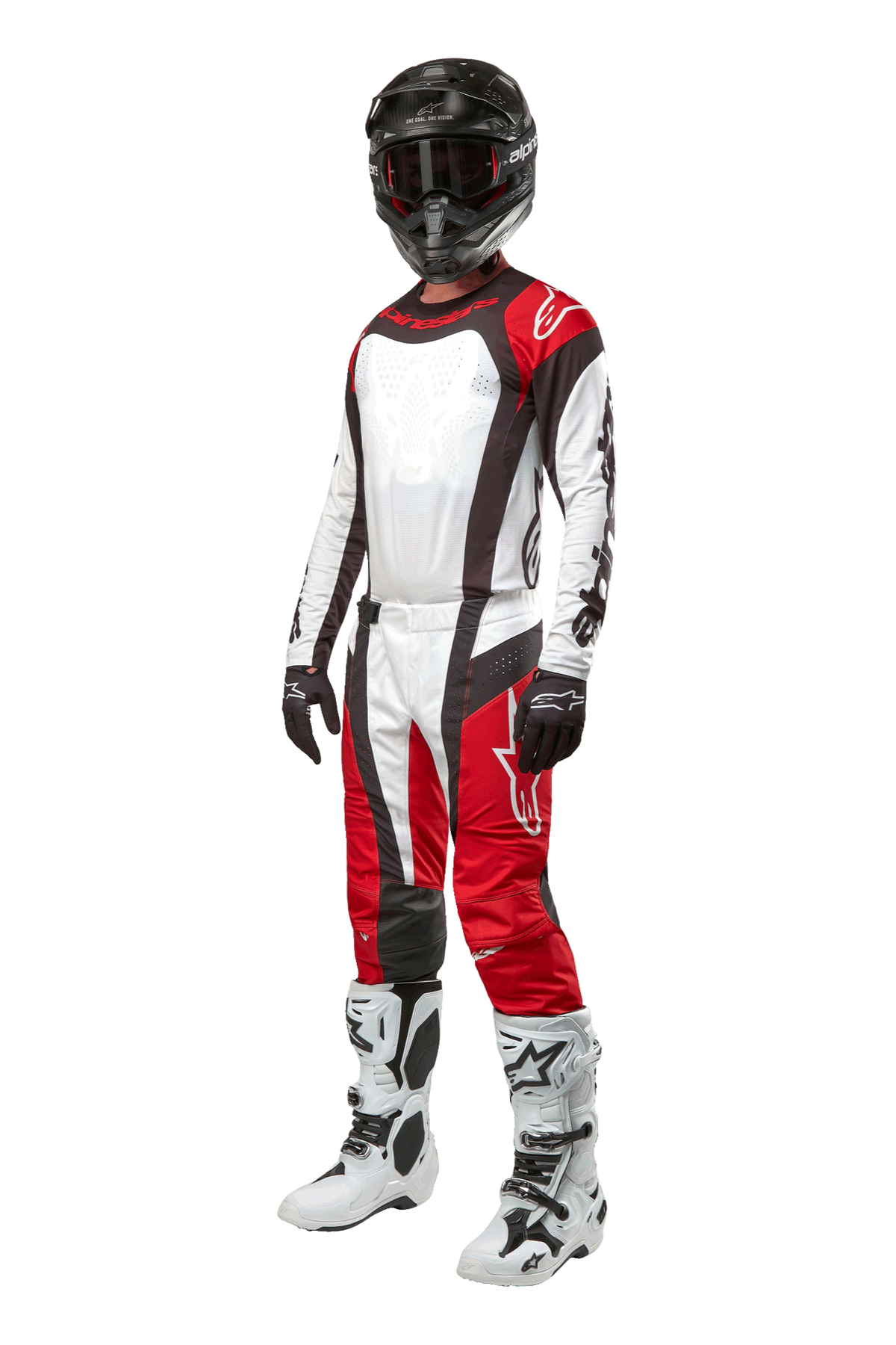Motocrossförare klädd i komplett Alpinestars-utrustning, 2024 Techstar Ocuri-byxor i Mars Red White Black, matchande tröja, svart hjälm med goggles, svarta och vita handskar och vita motocross-stövlar, professionell outfit för terrängkörning