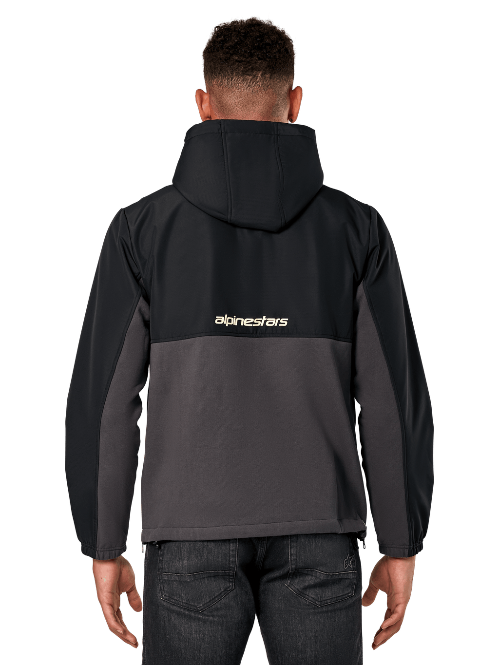 Alpinestars Juncture Hybrid-jacka, vy bakifrån, svart och gunmetal, avslappnad sportswear-anorak med konstruktion i blandade material, ripstop upptill och canvasfleece nedtill, Alpinestars-logotyp på ryggen, bärs med mörka byxor
