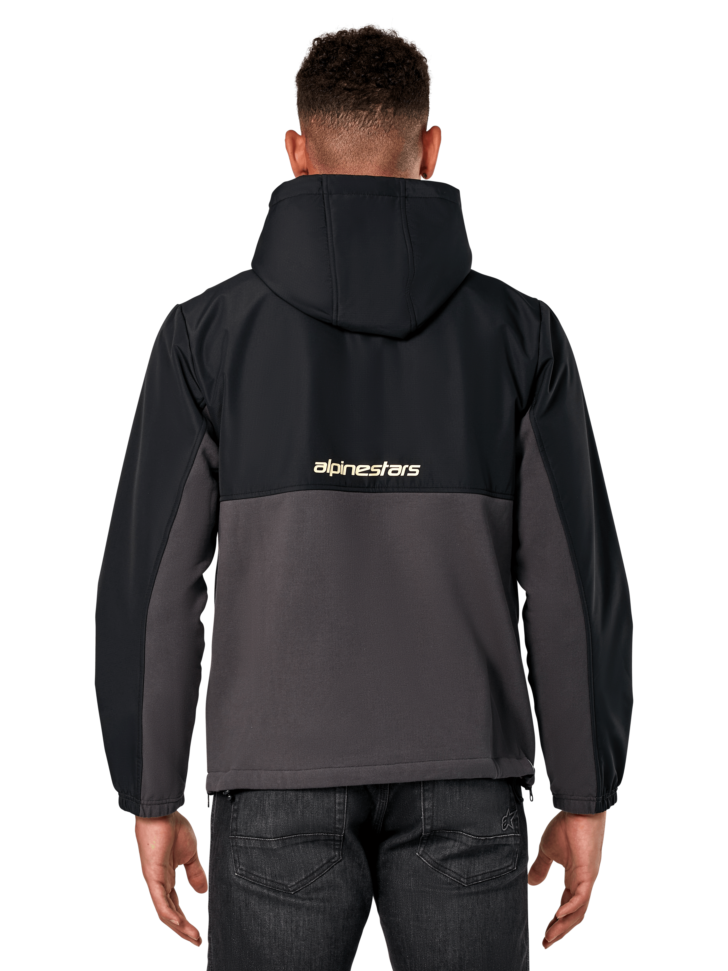 Alpinestars Juncture Hybrid-jacka, vy bakifrån, svart och gunmetal, avslappnad sportswear-anorak med konstruktion i blandade material, ripstop upptill och canvasfleece nedtill, Alpinestars-logotyp på ryggen, bärs med mörka byxor