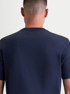 Alpinestars Ageless 2.0 CSF Tee, Navy Blue Sportswear T-Shirt, Unisex Casual Apparel, Back View on Model showing the cut-and-sew fit and premium cotton-poly blend construction.