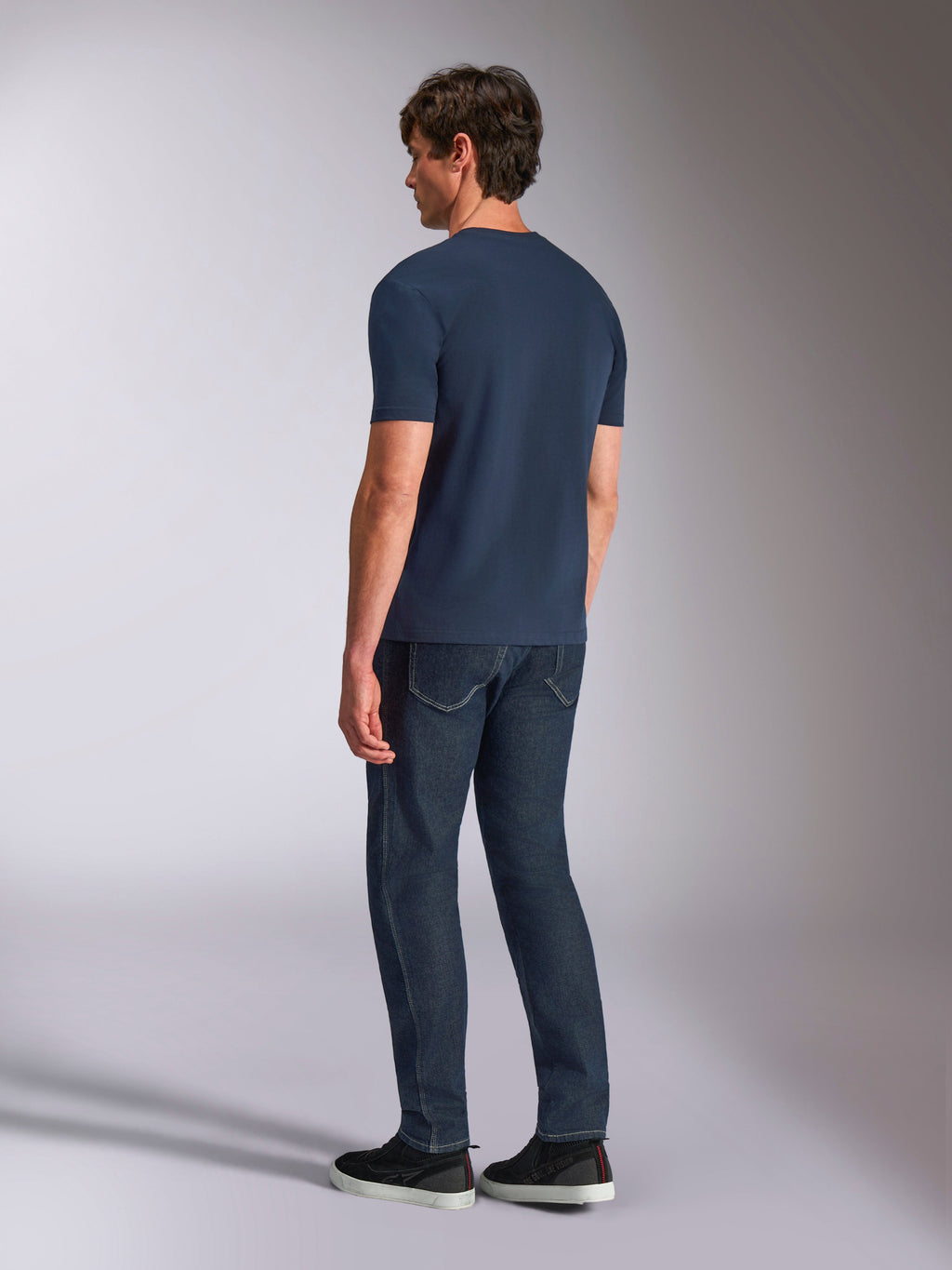 Alpinestars Ageless Shadow CSF Tee, Short Sleeve T-Shirt, Navy, back view on model, worn with dark denim jeans and black sneakers, casual lifestyle streetwear