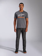 Alpinestars Always 2.0 CSF Tee, Short Sleeve T-Shirt, Charcoal Gray with White Logo and Orange Text, worn by model with dark jeans, Casual Motorsport Streetwear