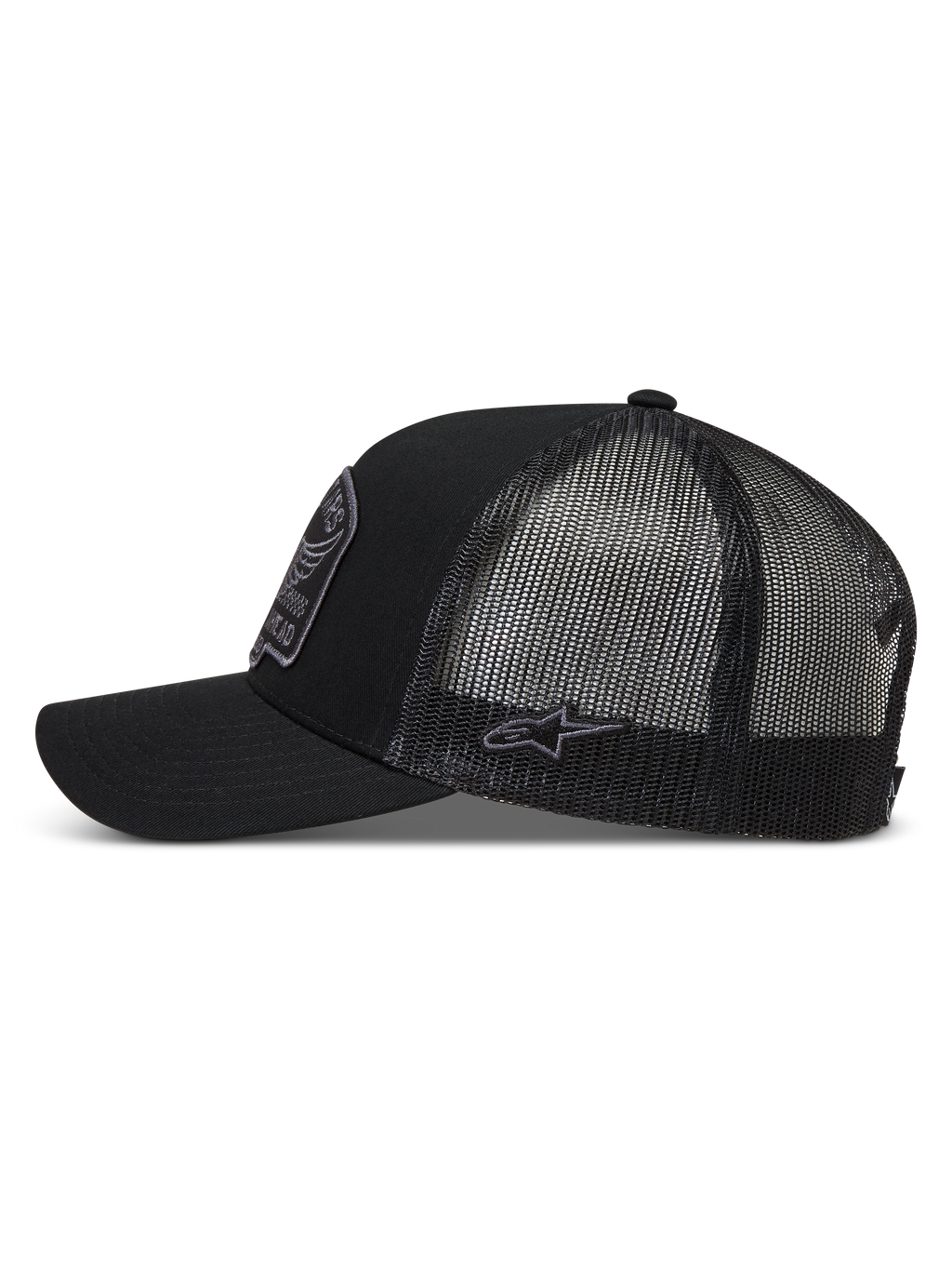 Alpinestars Heritage Patch truckerkeps, svart och grå, med böjd skärm, andningsbar meshbaksida och broderad logopatch på sidan.