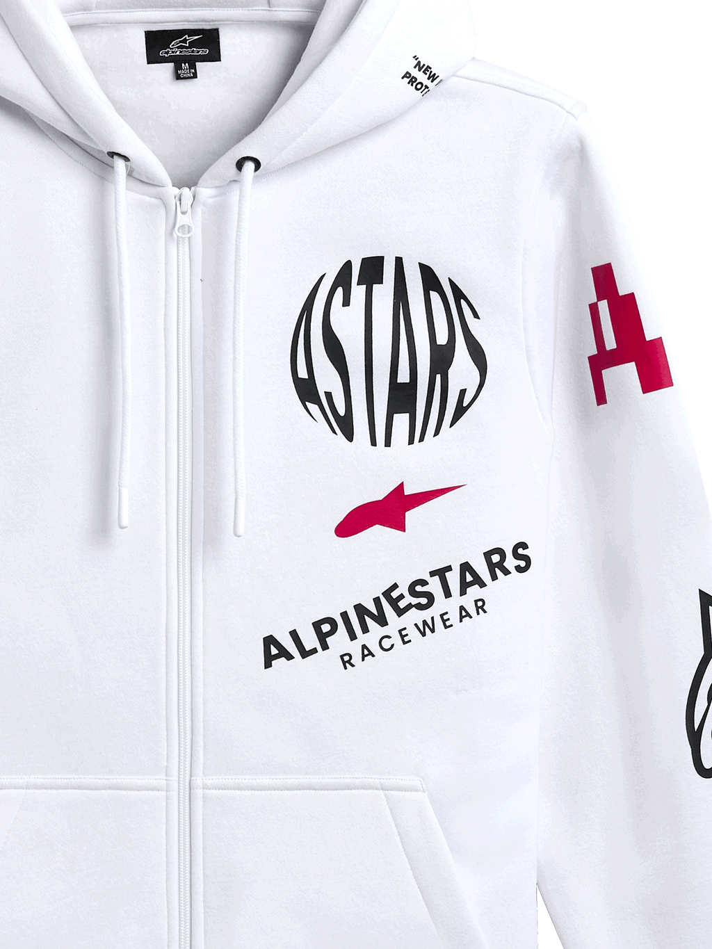 Alpinestars Variegate Hoodie, vit fleecehoodie med dragkedja fram, med cirkulär svart ASTARS-logotyp, röd stjärnsymbol och Alpinestars Racewear-märkning på bröstet, casual motorsport-streetwear
