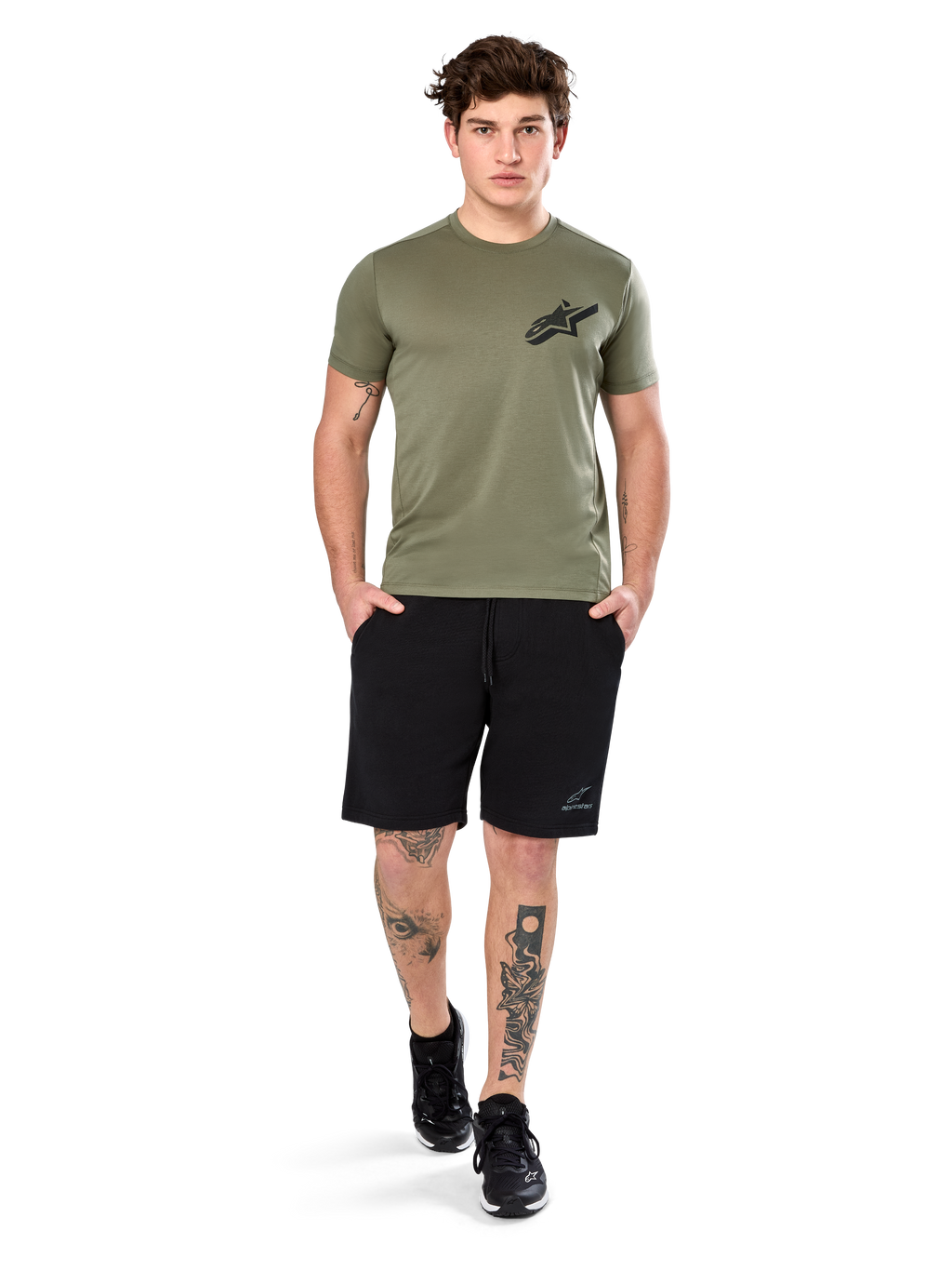Alpinestars Attrition Performance Tee, Short Sleeve T-Shirt, Light Green, featuring a black Astars logo on the chest, worn with black athletic shorts and black sneakers, casual performance sportswear lifestyle shot