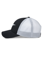 Alpinestars Terolithic Trucker keps, vy i sidoprofil, svarta frampaneler och böjd skärm med vita meshpaneler baktill, casual keps i snapback-modell