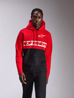 Alpinestars Parallel huvtröja, vardaglig streetwear, färgblockerad design i rött och svart, stor vit Alpinestars-ordlogga och Astars-logga på bröstet, huva med dragsko, känguruficka fram, motorsport-inspirerad design