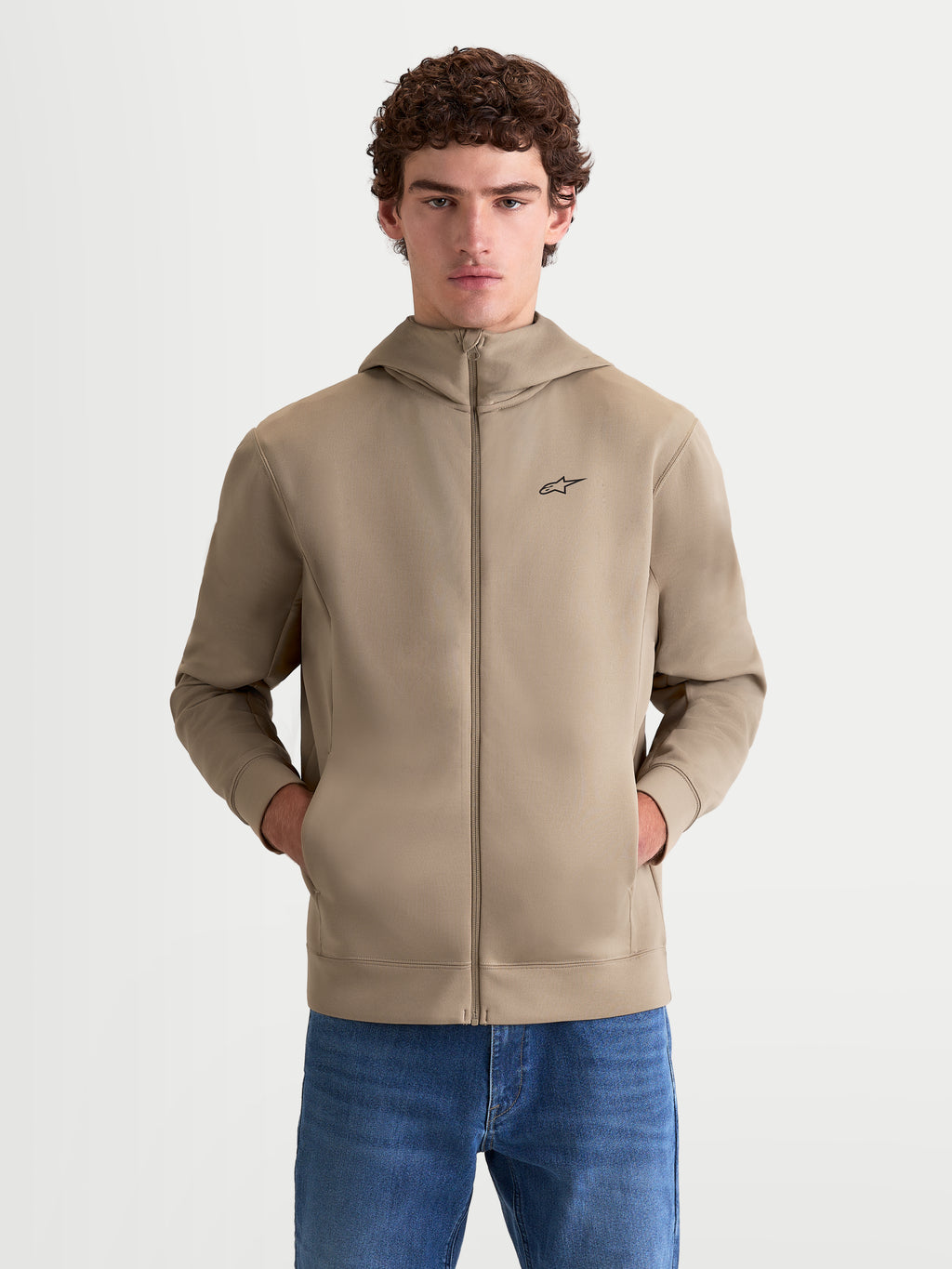 Alpinestars Cypher Hoodie, Men's Full-Zip Sportswear Hoodie, Putty Beige, featuring a high-neck hood, tri-blend double-face fleece fabric, and a black Alpinestars chest logo, on-model front view with hands in pockets.