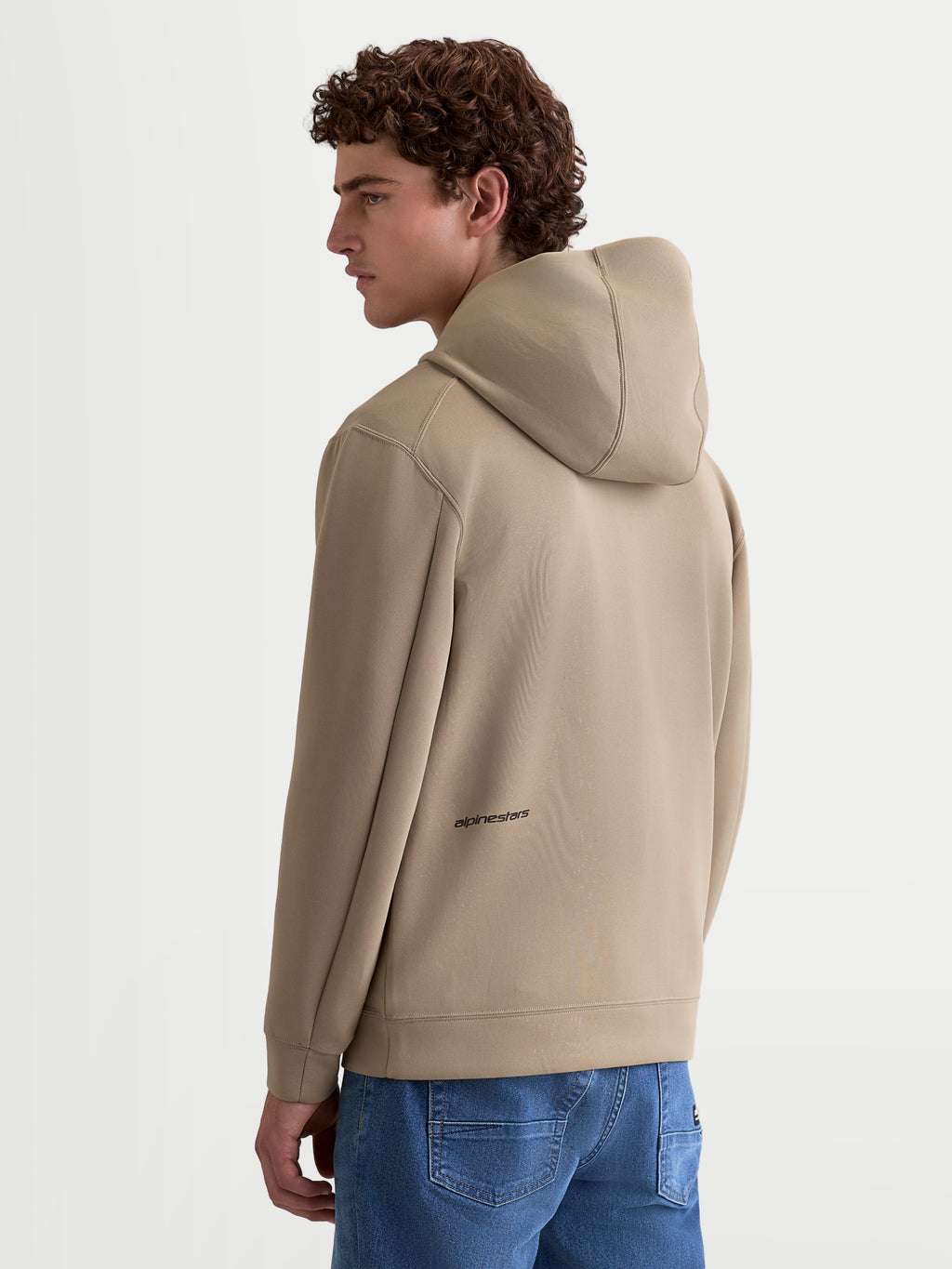 Alpinestars Cypher Hoodie, Men's Sportswear Fleece, Rear View in Putty Beige, featuring a high-neck hood and motorsport-inspired design with Alpinestars logo detail on the lower back.