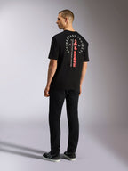Alpinestars Overhang Oversized CSF Tee, kortärmad t-shirt, svart, med vertikalt rött ordmärke och cirkulär vit grafik på ryggen, avslappnat motorsport-streetwear