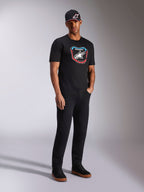 Alpinestars Plate CSF Tee, Short Sleeve T-Shirt, Black, colorful front MX plate graphic with star logo, worn by model with black logo cap and pants, casual motorsport-inspired streetwear