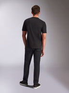 Alpinestars Trifecta CSF Tee, Short Sleeve T-Shirt, Black, back view on male model, worn with black pants and black sneakers, casual motorsport-inspired streetwear