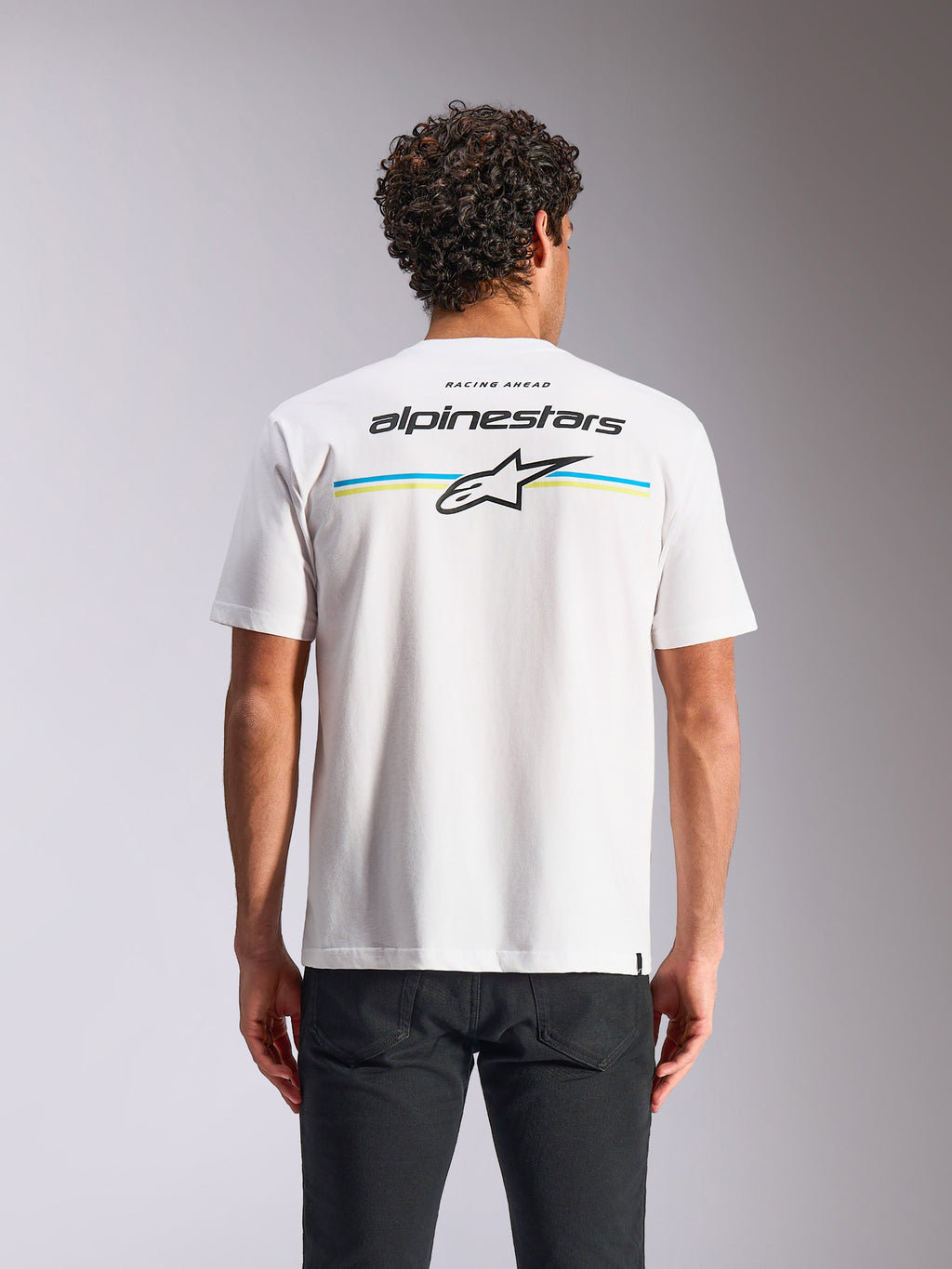 Alpinestars Lanes CSF Tee, kortärmad t-shirt, vit, ryggvy med flerfärgade ränder samt Alpinestars- och Astars-logotyper, avslappnad motorsport-streetwear