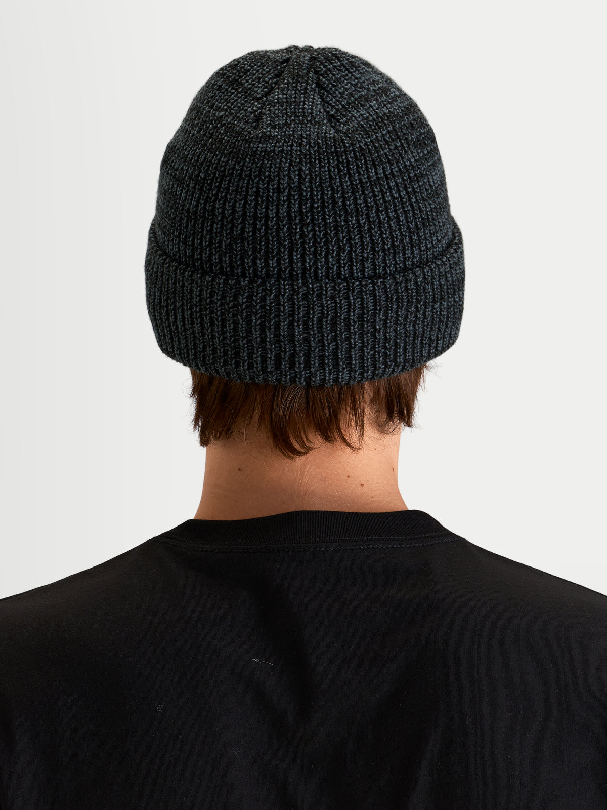 Alpinestars Unload Rib Cuff Beanie, sportswear winter hat in charcoal melange, back view on a model showing knit jersey stitch construction and fold-up cuff