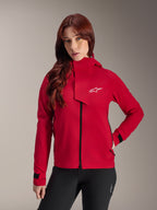 Alpinestars Stella A-Dura Elite Vattentät Jacka, mountainbikejacka för dam, Red Fluo, med en vindslå framtill med en vit Alpinestars-logotyp, hög krage och justerbara manschetter, bärs med svarta byxor för en teknisk look