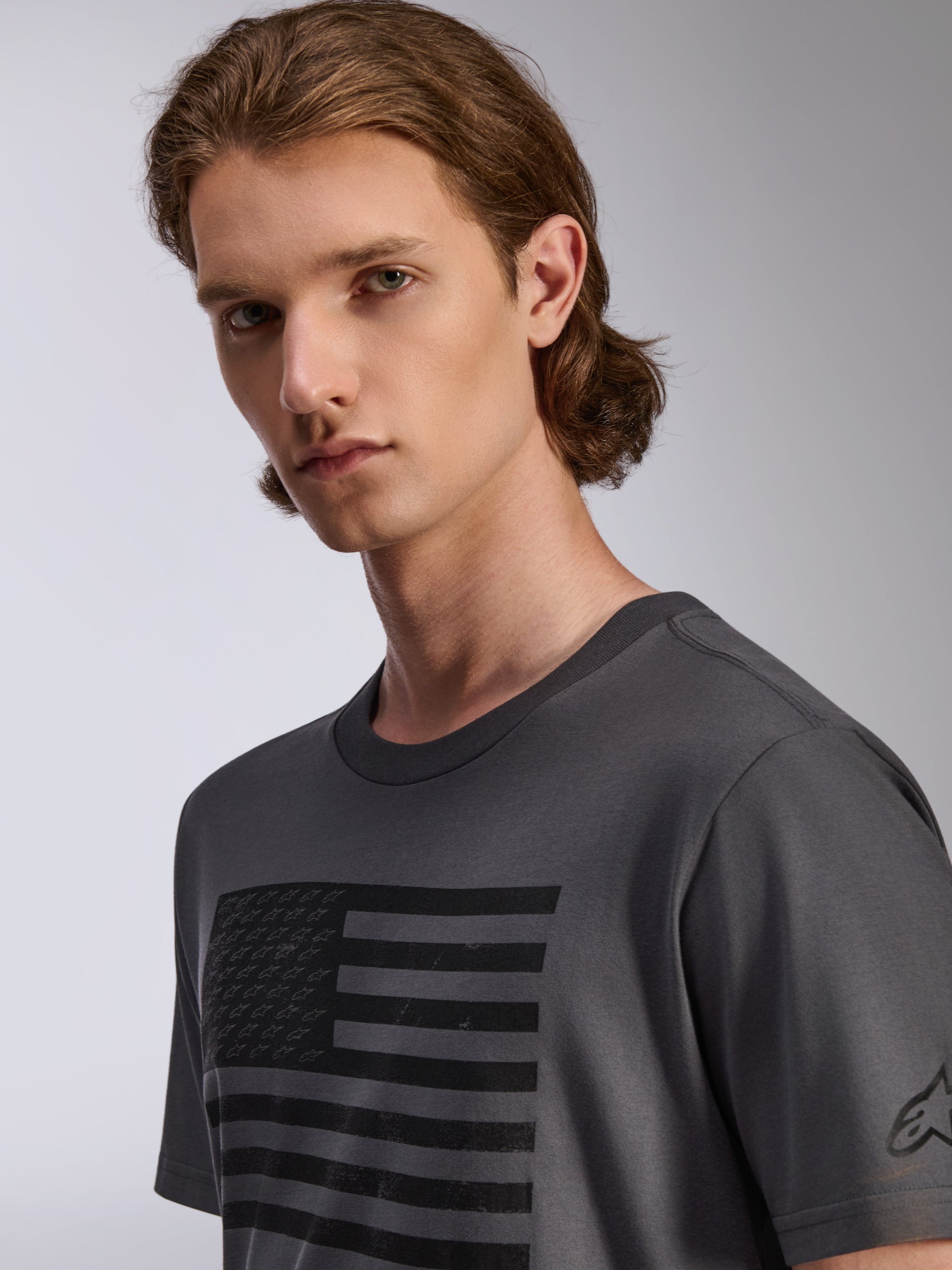 Alpinestars Waving CSF Tee, Short Sleeve T-Shirt, Charcoal, featuring a black distressed flag graphic with small star logos, men's casual sportswear