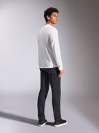 Alpinestars Trackside CSF Tee, Long Sleeve T-Shirt, White, male model viewed from the back wearing black pants, casual motorsport-inspired streetwear