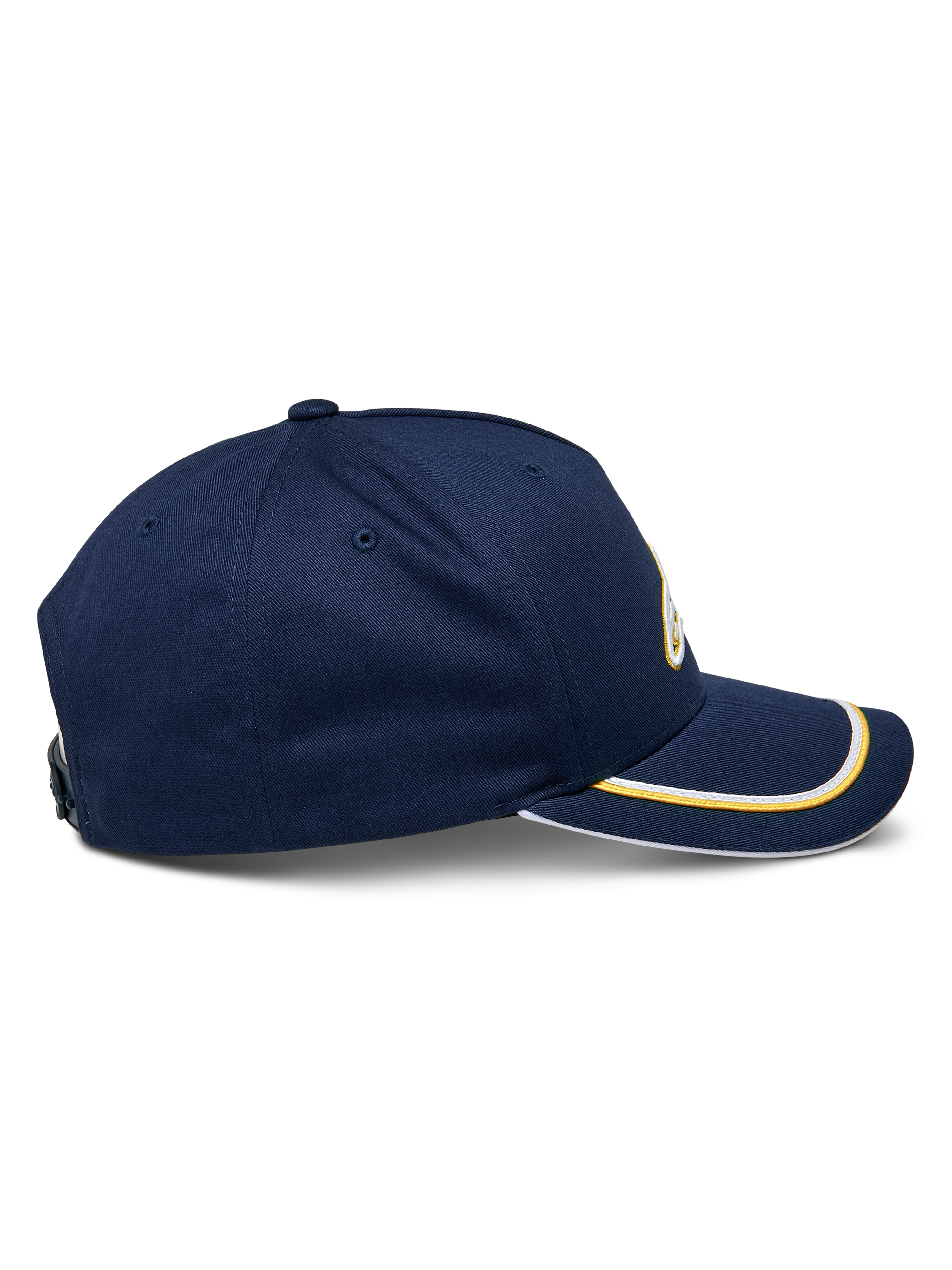 Alpinestars Ascension Snapback-keps, sidovy, marinblå med guld- och vit soutache-kant på den böjda skärmen, strukturerad krona, avslappnad motorsport-huvudbonad