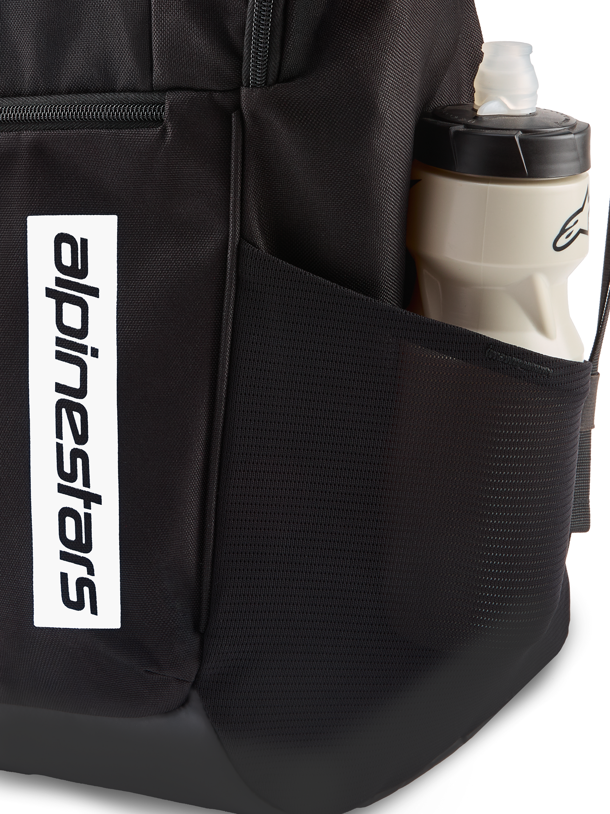 Alpinestars Defcon V3 Backpack, black daily backpack, close-up of side mesh pocket with water bottle, vertical white logo branding on front, durable 600D polyester material
