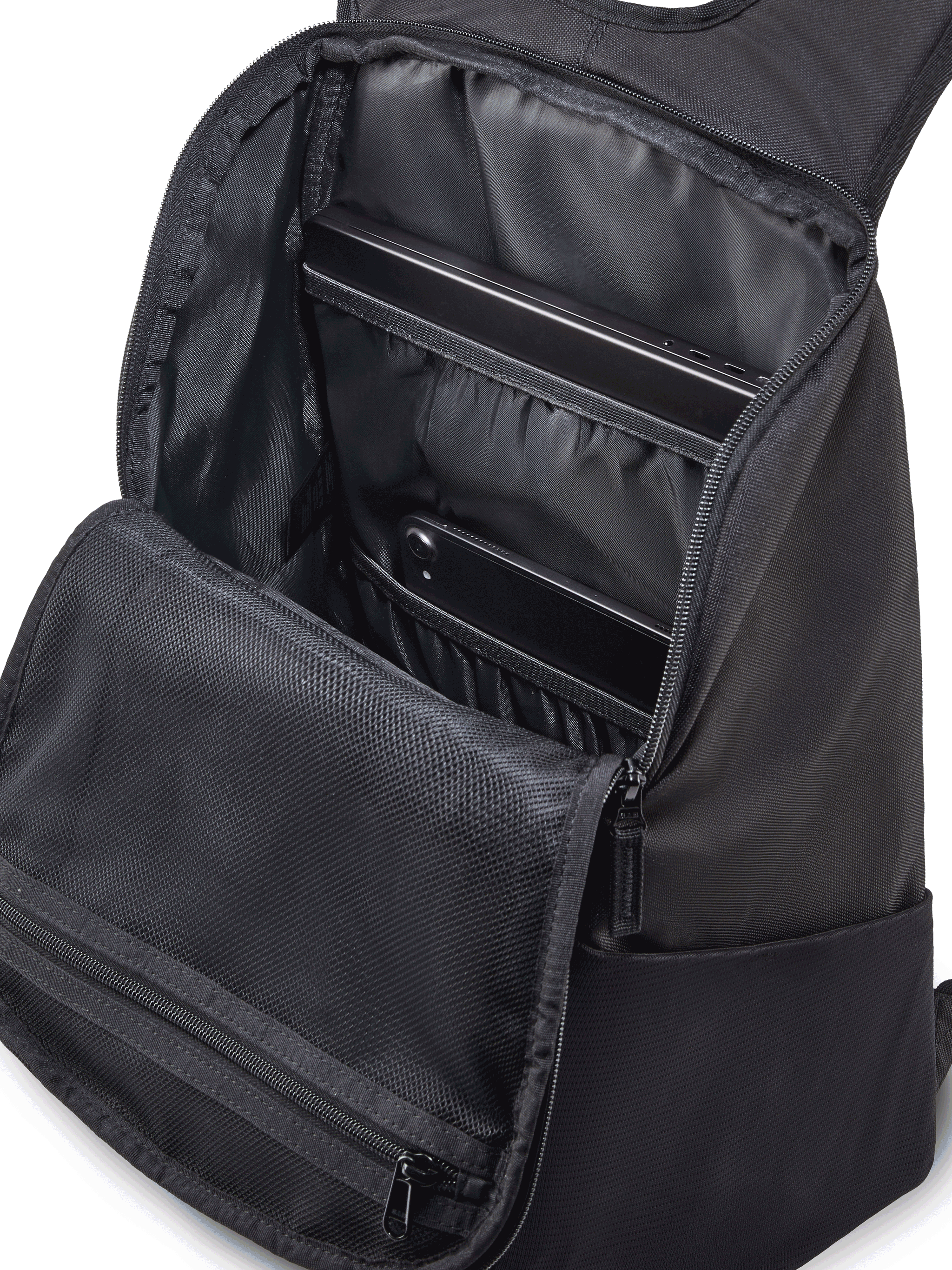 Alpinestars Defcon V3 Backpack, Black and White small daily backpack, durable 600D polyester, featuring front zipper pocket, mesh water bottle pockets, and printed Alpinestars branding.