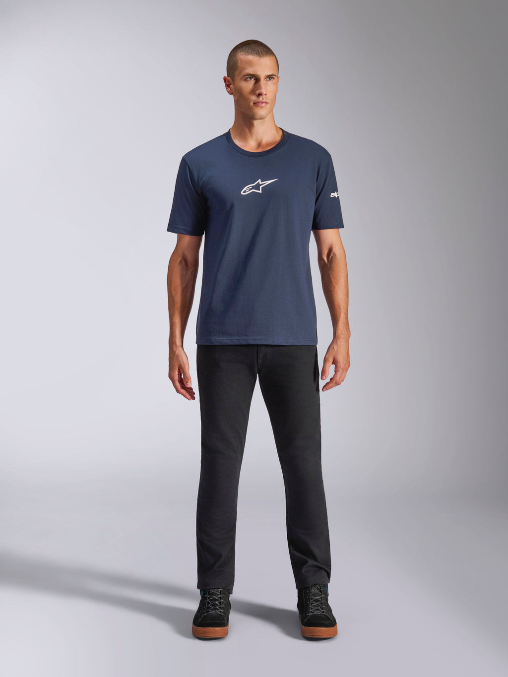 Alpinestars Frontal CSF Tee, Short Sleeve T-Shirt, Navy Blue, white Alpinestars star logo on chest, worn with black pants and sneakers, casual performance sportswear
