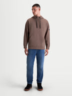Alpinestars Camino Textured Oversized huvtröja, sportig pullover för herrar, brun, med texturerad stickad twillfleece, hög krage med dragskor och känguruficka i en avslappnad silhuett.